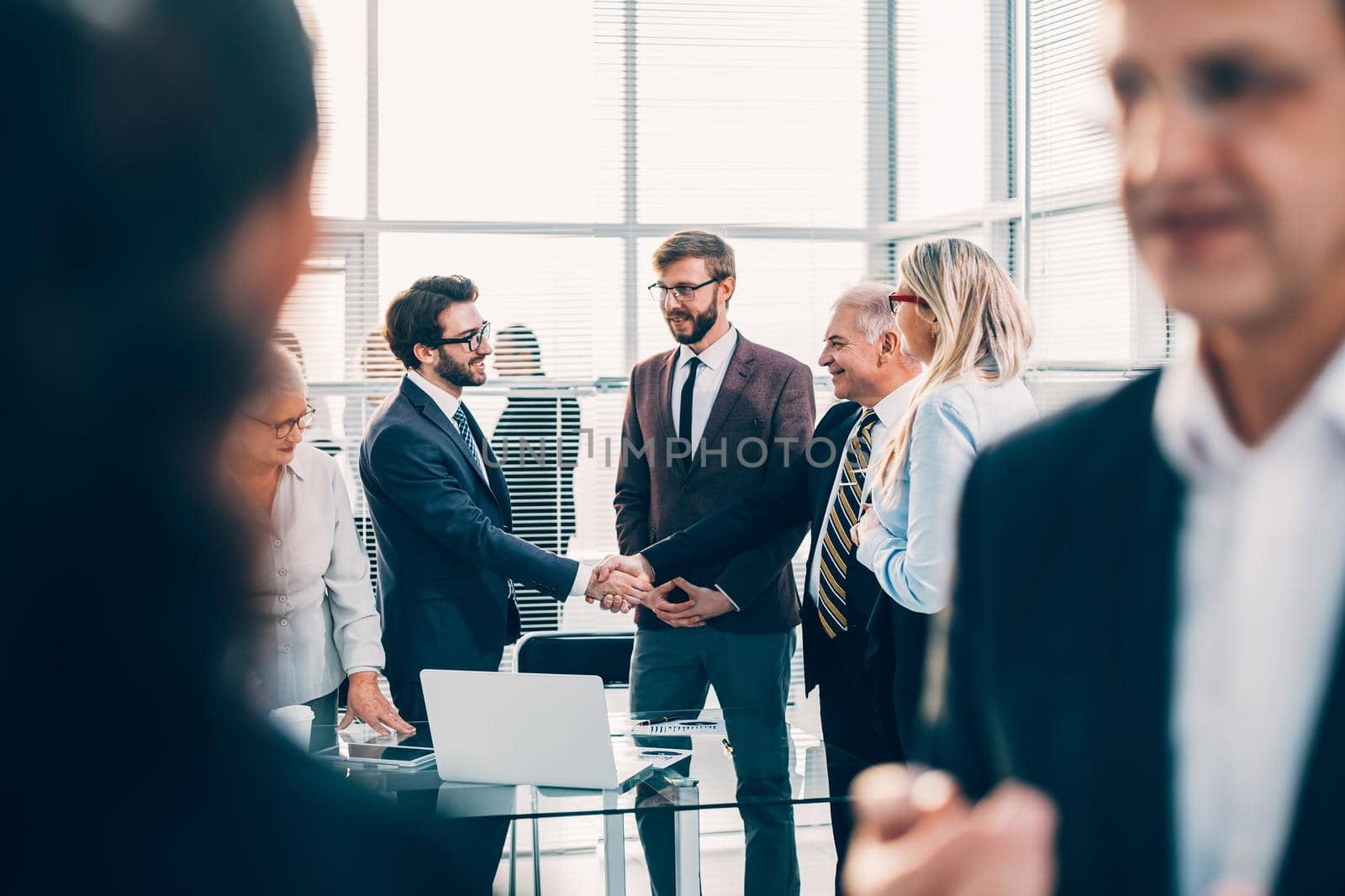 close up. business partners meeting each other with a handshake. by SmartPhotoLab