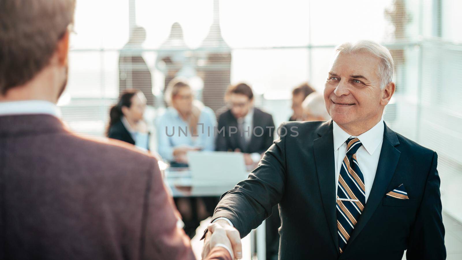 close up. reliable handshake of business people. by SmartPhotoLab