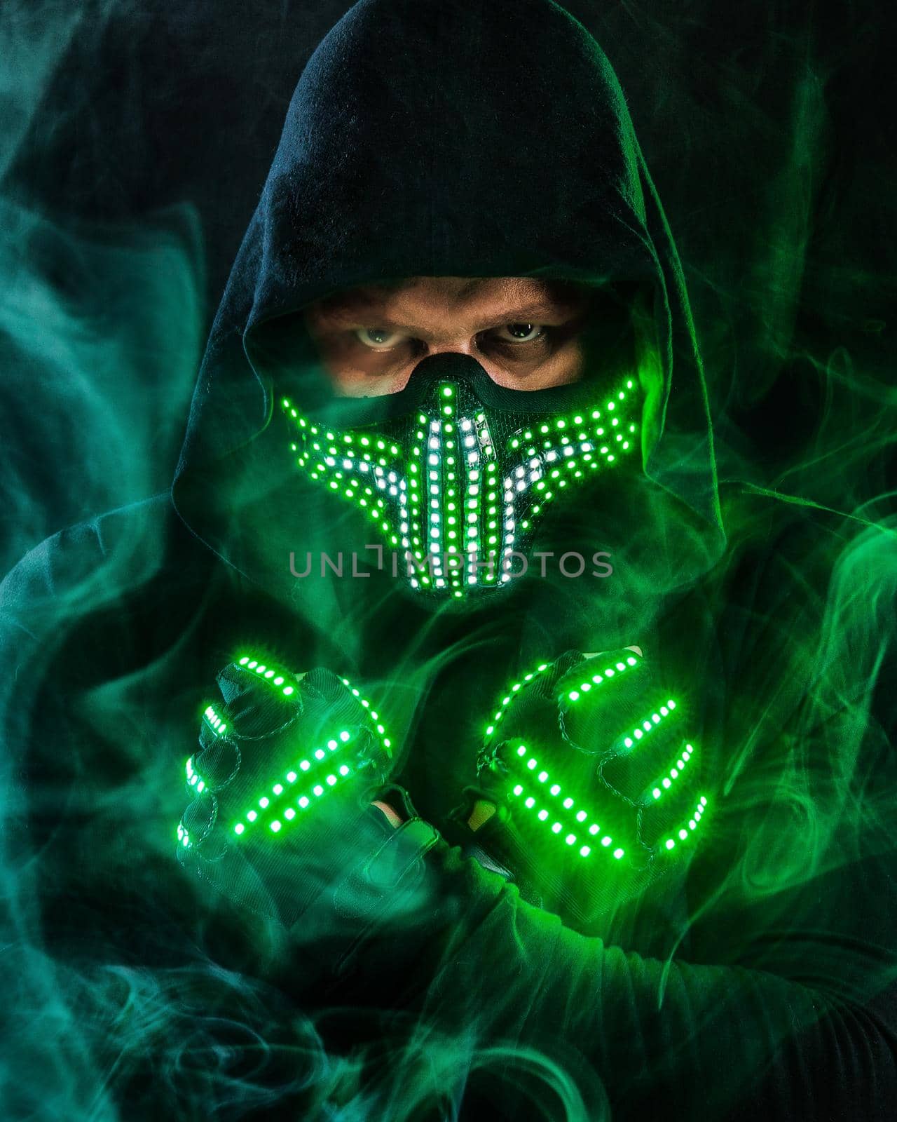 Mysterious man in black wear, neon mask and gloves. Character pastor or wizard in robe from the future. Assassin with strong face expression. Fantasy book or computer game cover concept. by MikeOrlov