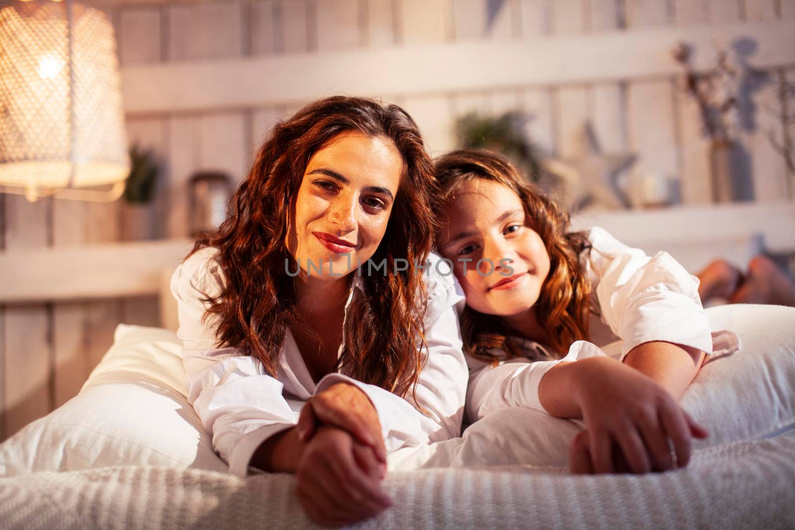 young pretty girls in bed at Christmass morning, happy family smiling lifestyle at holiday close up