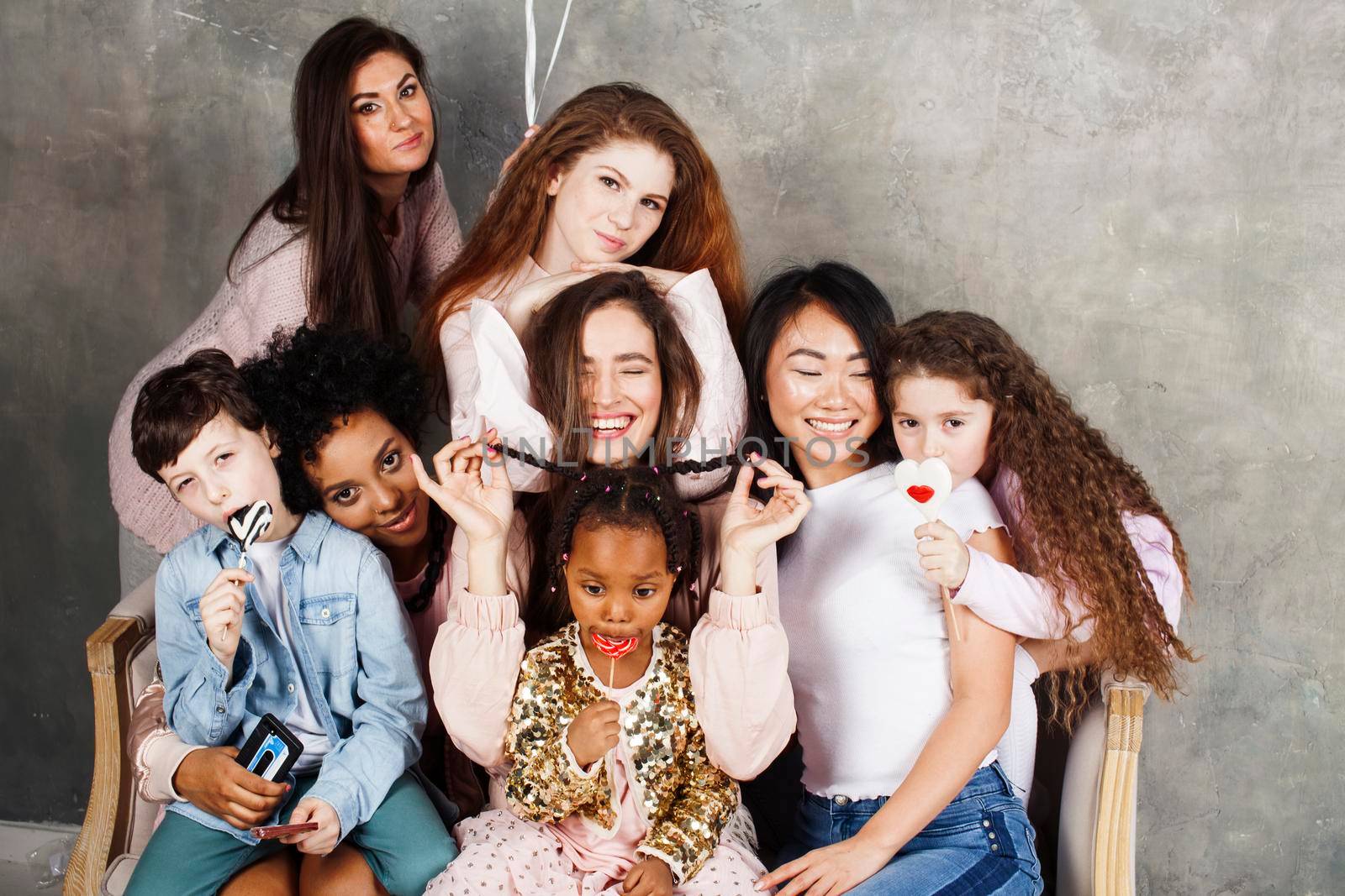 Lifestyle and people concept: young pretty diversity nations woman with different age children celebrating on birth day party together happy smiling, making selfie. African-american, asian and caucasian by JordanJ