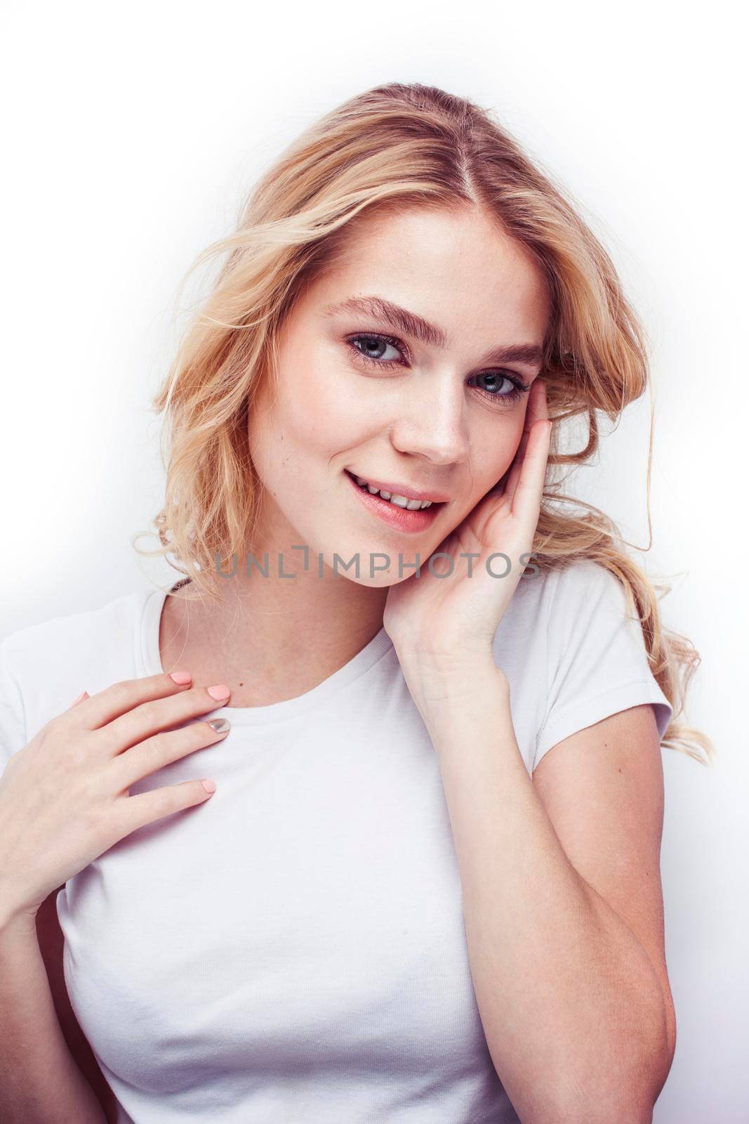 young pretty stylish blond hipster girl posing emotional isolated on white background happy smiling cool smile, lifestyle people concept by JordanJ