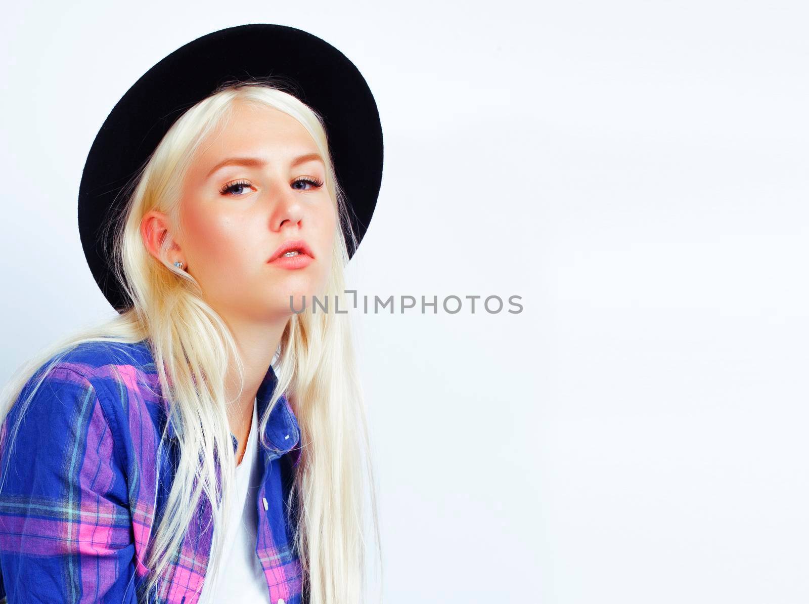 young pretty stylish blond hipster girl in hat posing emotional isolated on white background, lifestyle people concept by JordanJ