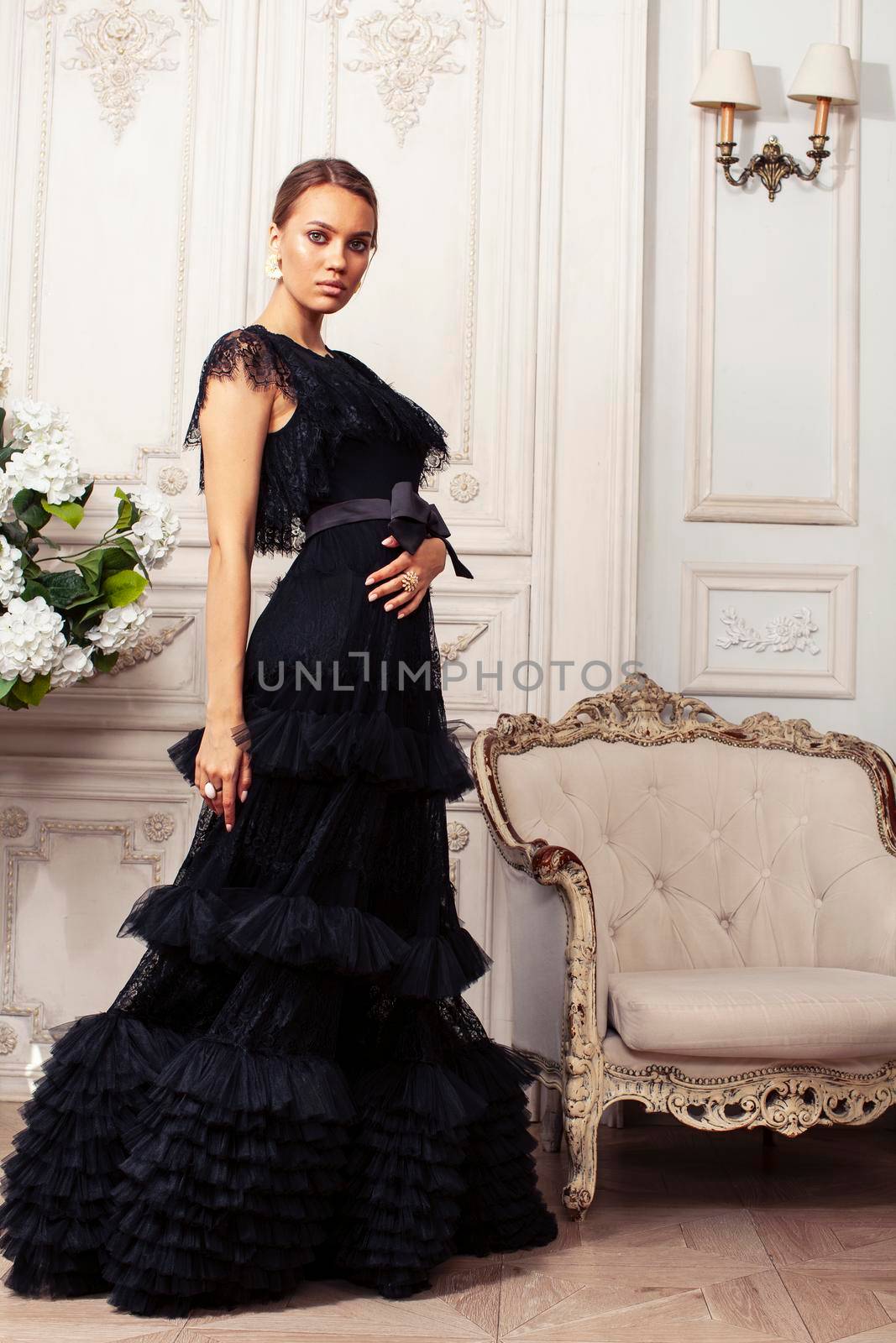 young pretty lady in black lace fashion style dress posing in rich interior of royal hotel room, luxury lifestyle people concept by JordanJ