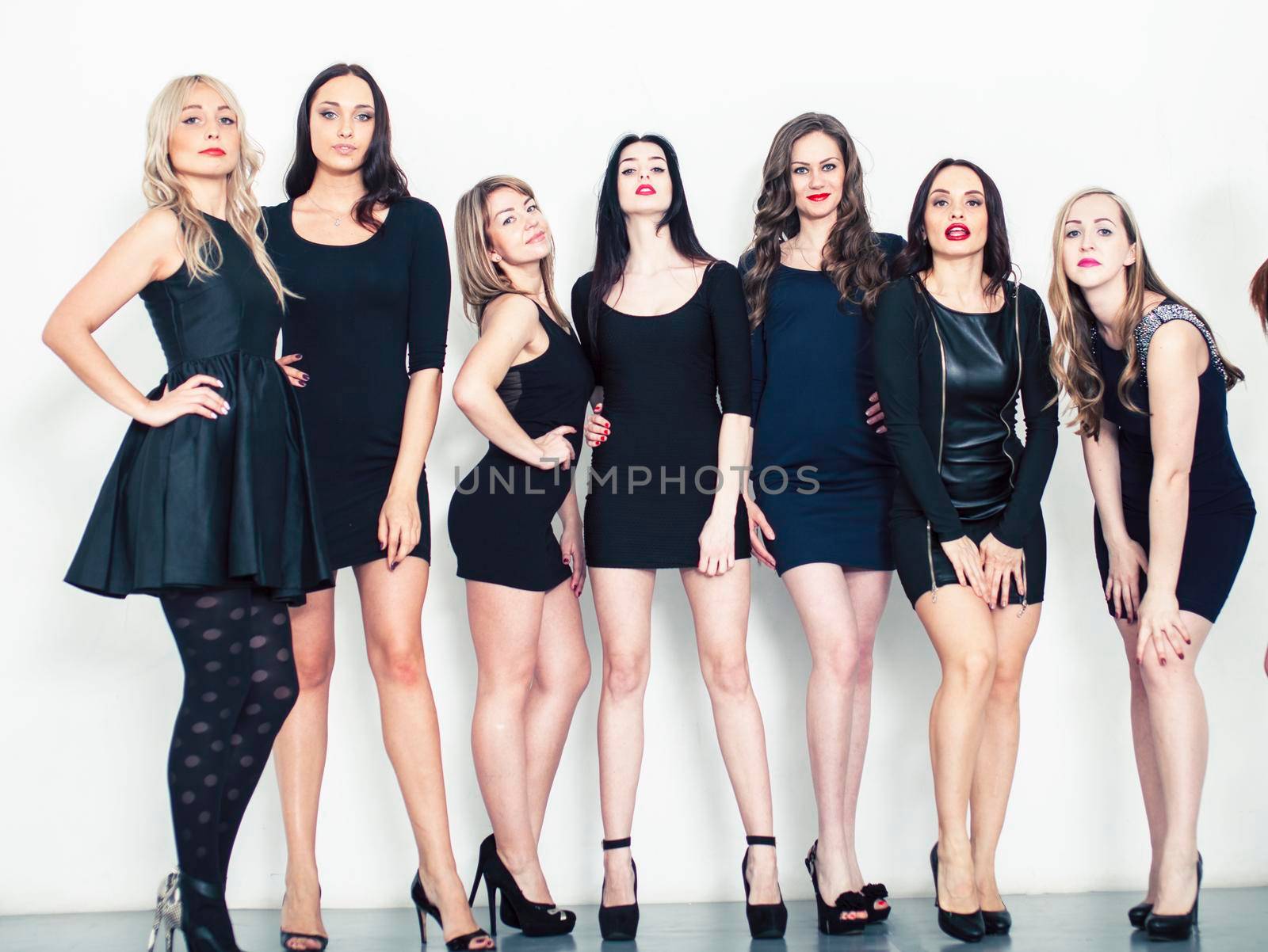 Many diverse women in line, wearing fancy little black dresses, party makeup, vice squad concept, lifestyle people by JordanJ