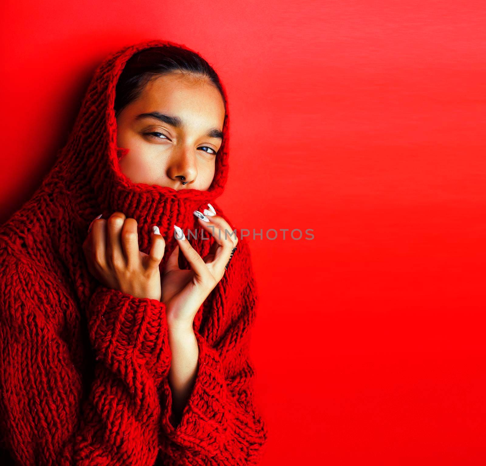 young pretty indian girl in red sweater posing emotional, fashion hipster teenage, lifestyle people concept by JordanJ