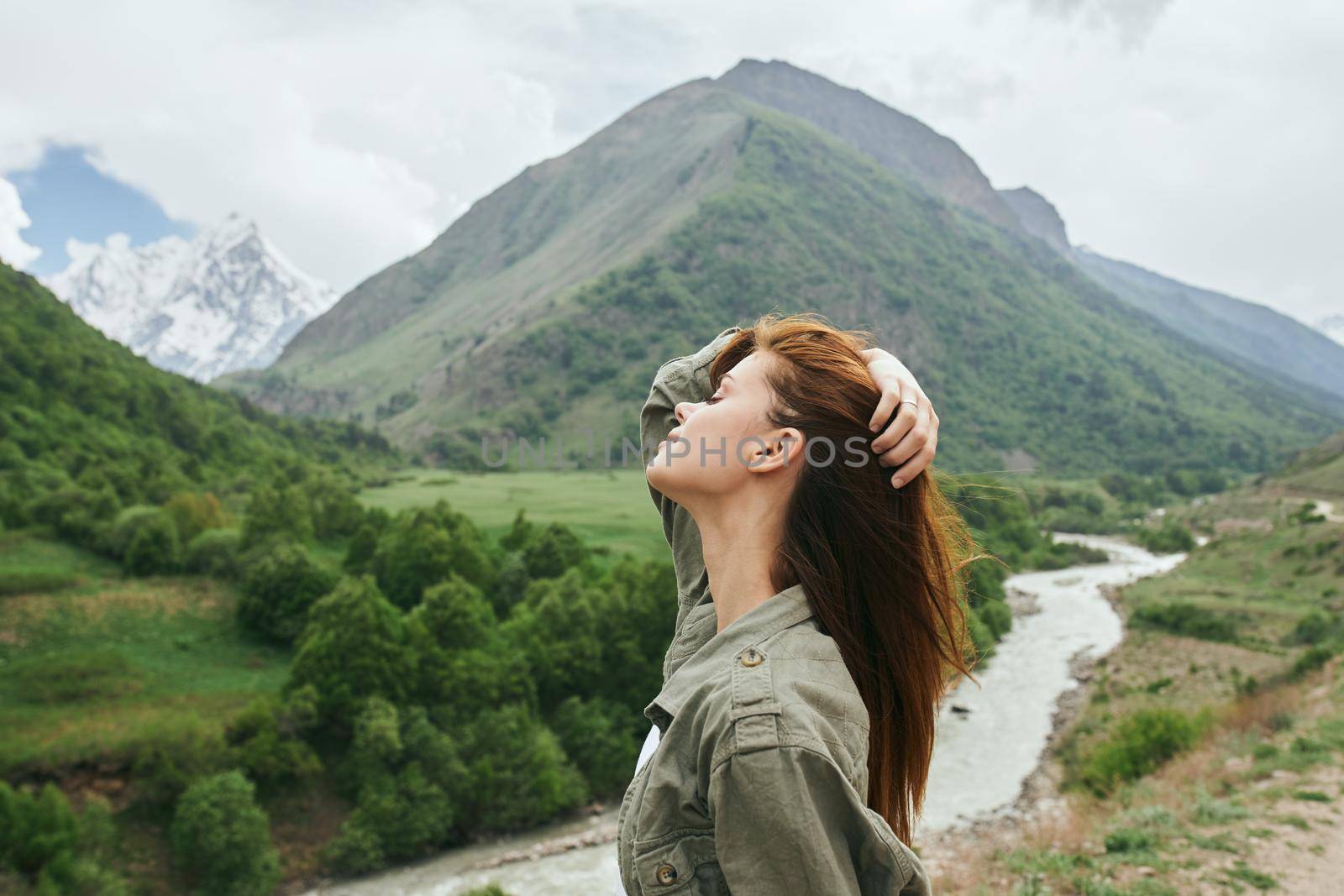 woman hiker mountains landscape travel freedom fresh air. High quality photo