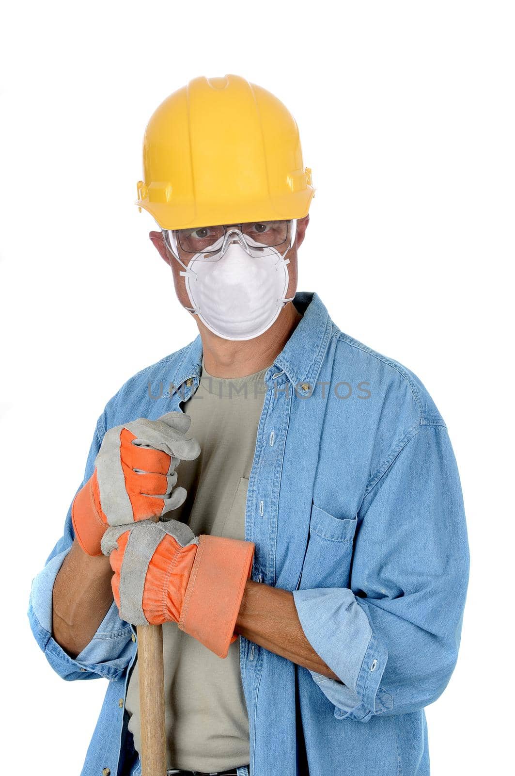 Construction worker wearing hard had and protective mask holding onto the handle of his shovel. Isolated over white in vertical format.