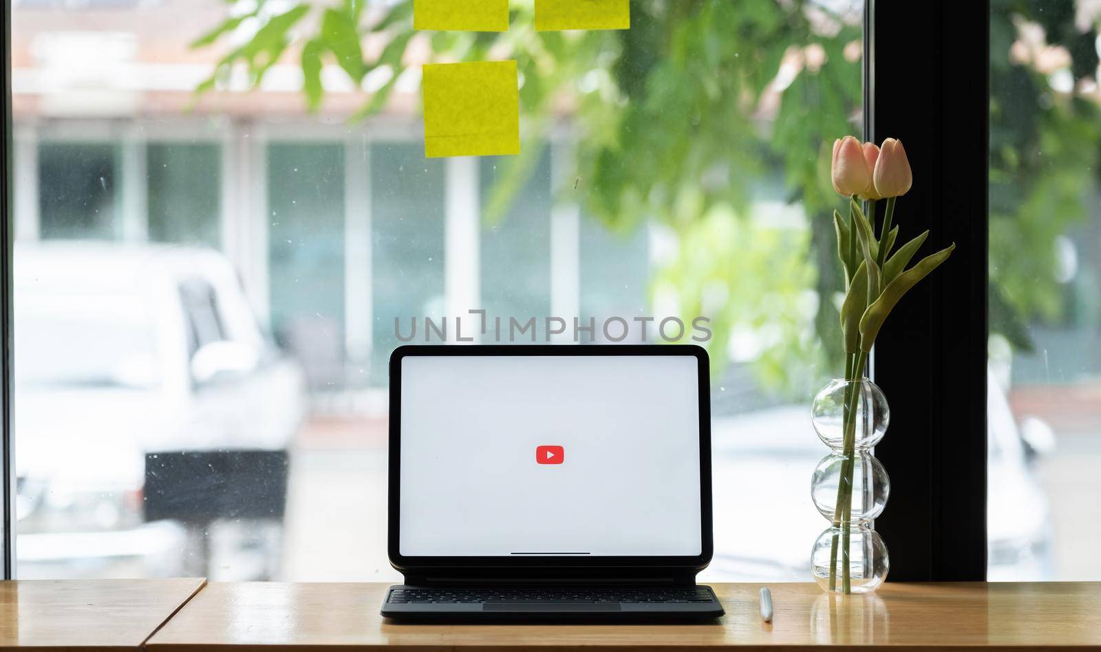 CHIANG MAI, THAILAND - JUNE 6, 2021 : YouTube logo on the screen iPad Pro. YouTube is the popular website