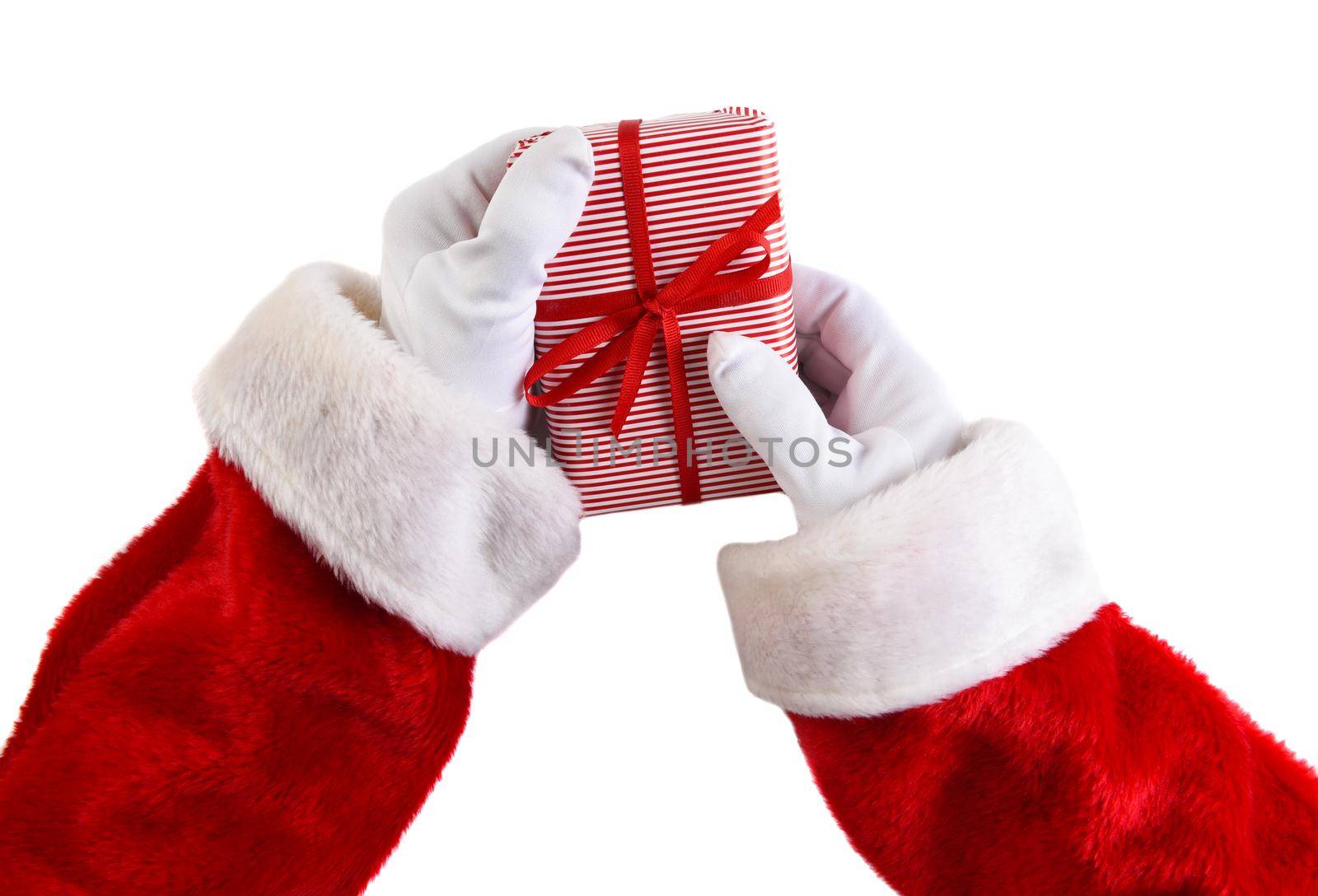 Santa Holding a small wrapped gift isolated on white. Hands only.