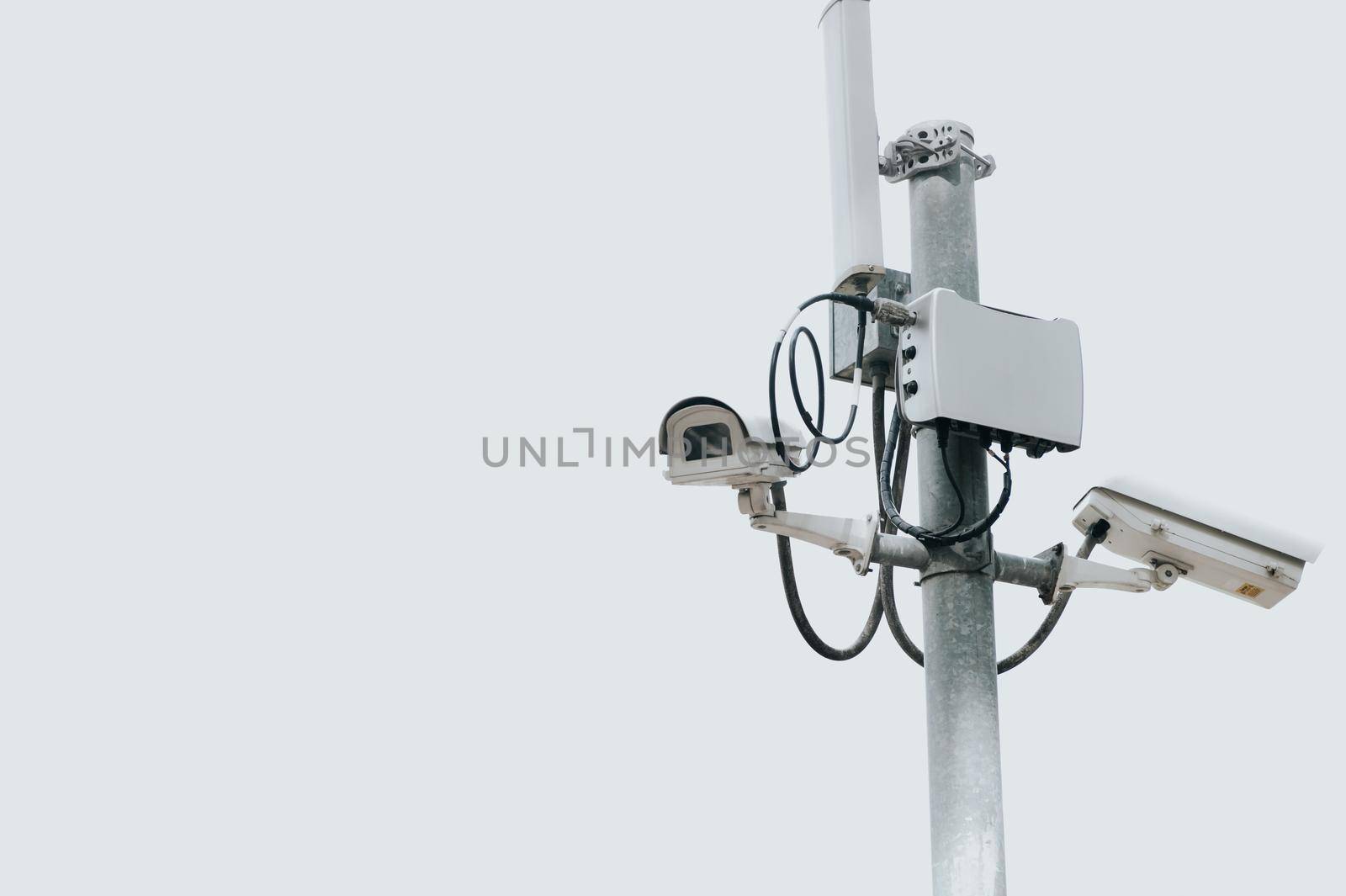 CCTV camera electric pole on isolated white sky with copy space. Safe and secure technology outside property and homeowner concept. Security card device and gadget theme. Outdoor electronic