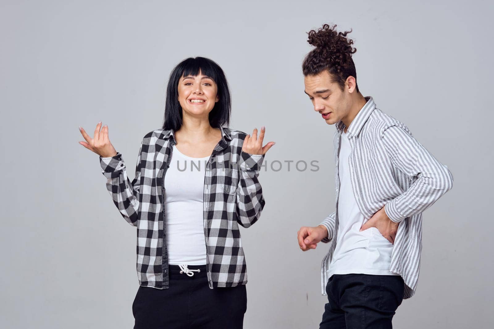 young couple modern clothes posing fun friendship. High quality photo