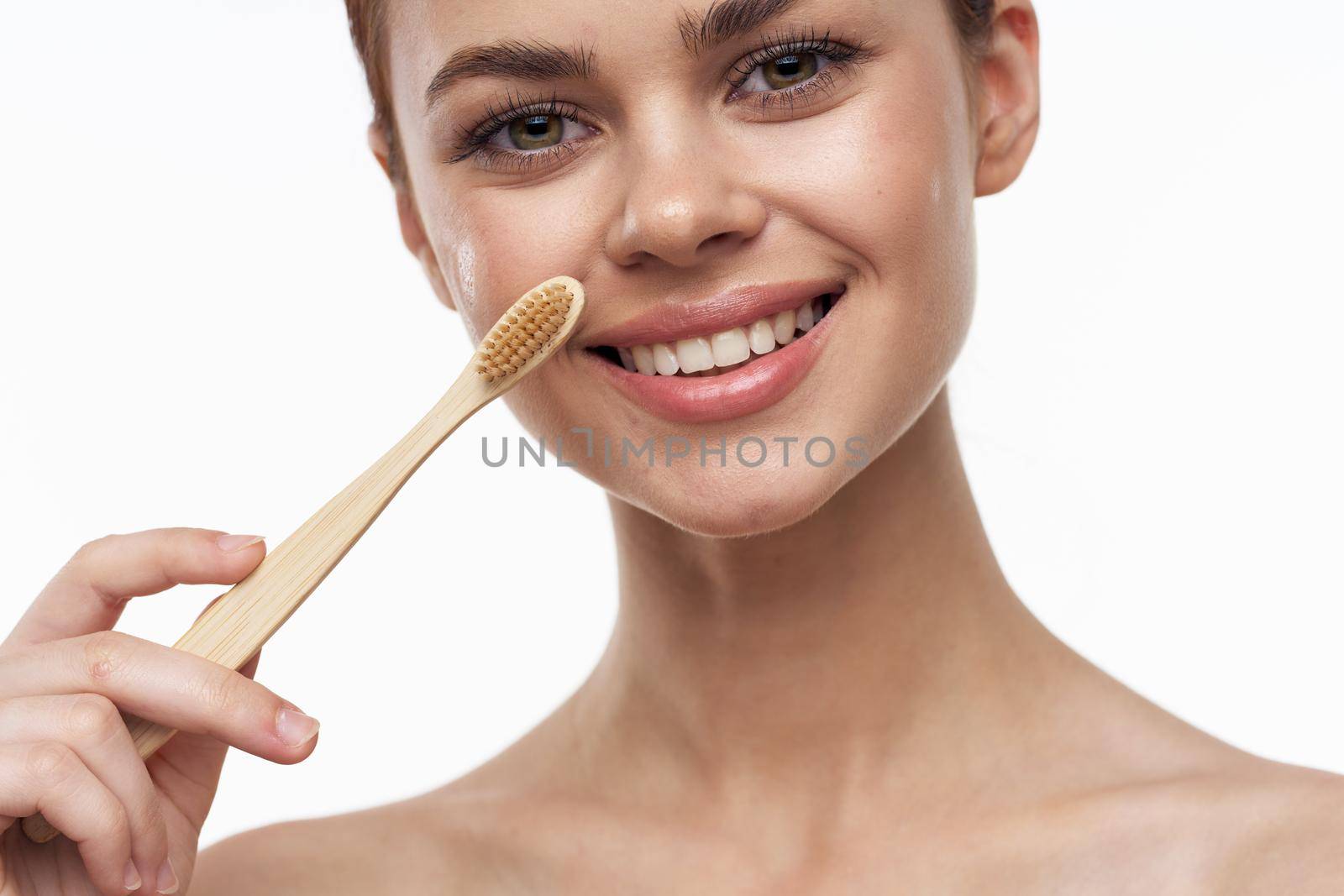 cheerful woman with bare shoulders toothbrushes hygiene oral care by Vichizh