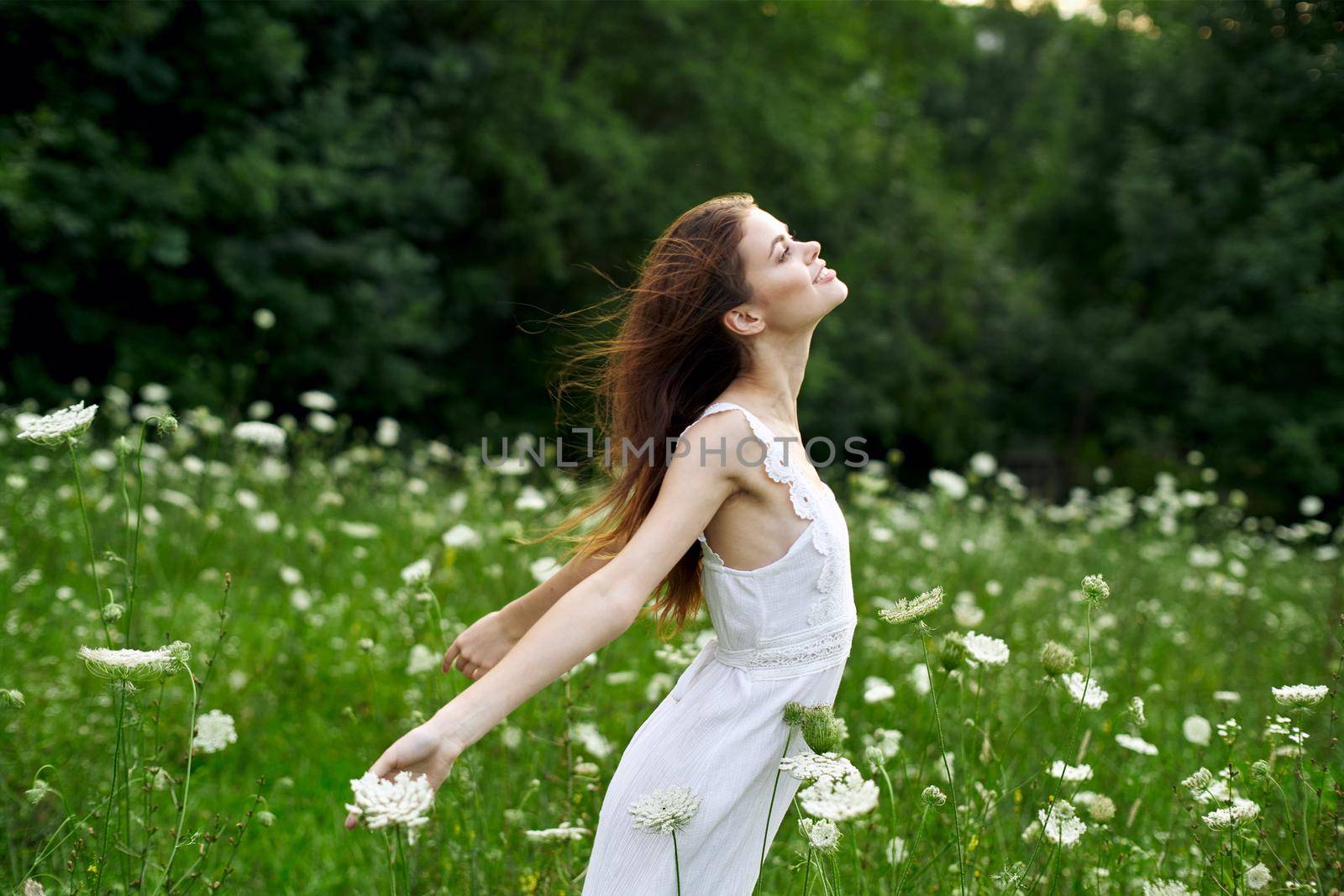 cheerful woman outdoors flowers freedom summer nature by Vichizh