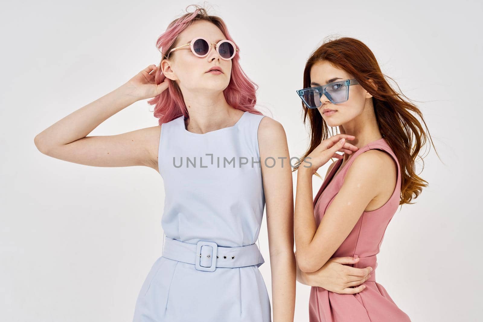 two women in fashionable clothes posing model decoration. High quality photo