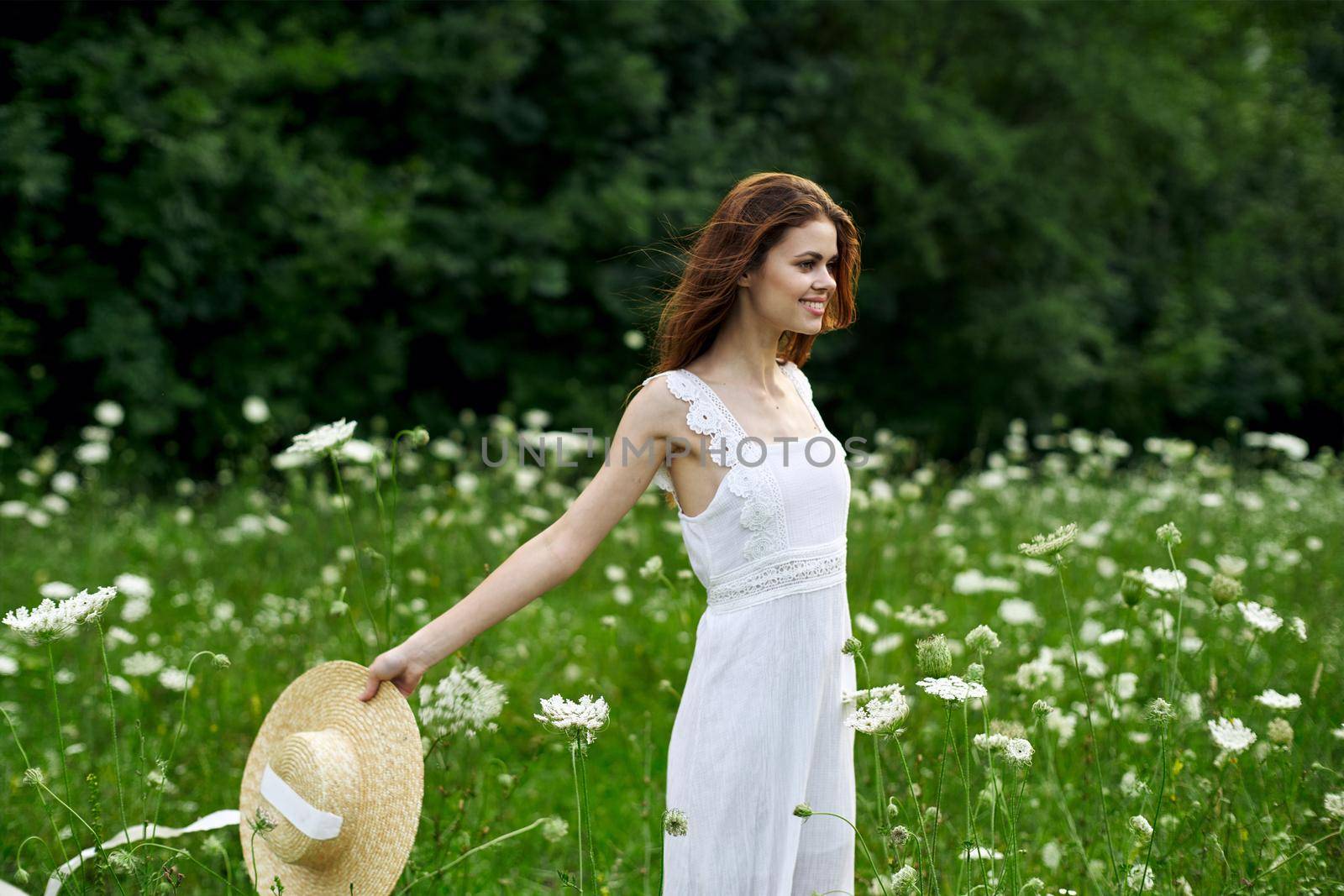 Woman in white dress hat nature field flowers by Vichizh