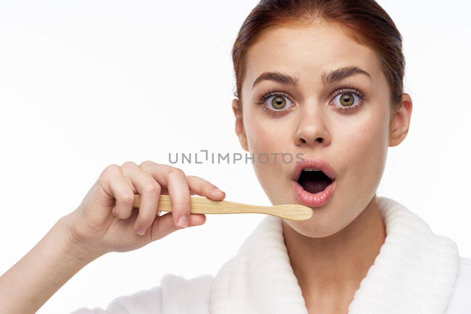 cheerful woman in white coat toothbrush dental health hygiene. High quality photo