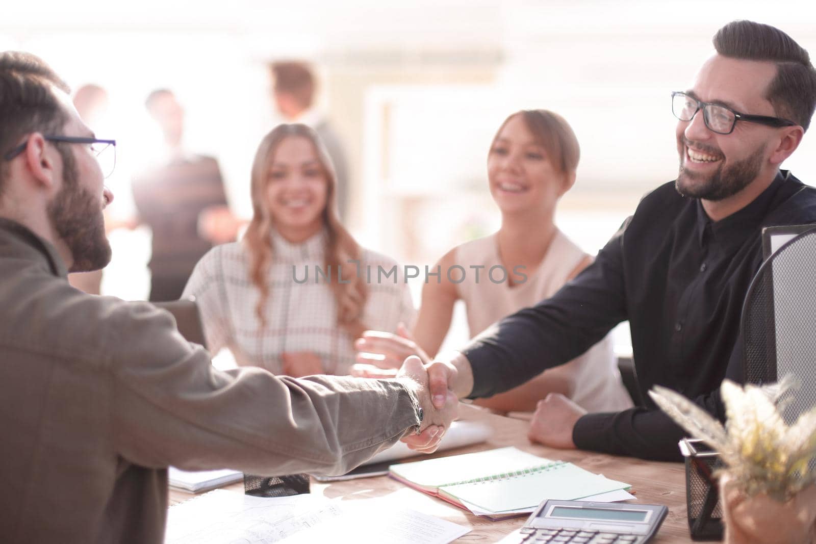 smiling businessman at a working meeting in the office. photo with copy space
