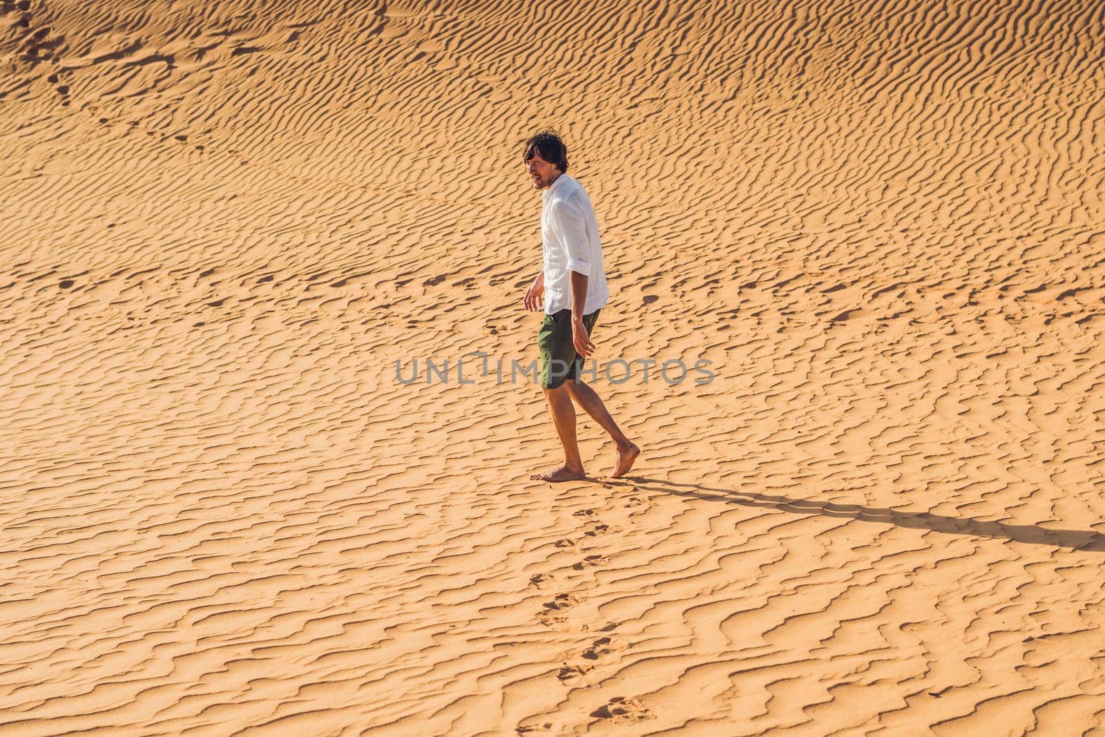 A man lost in the red desert in Vietnam, Mui Ne.