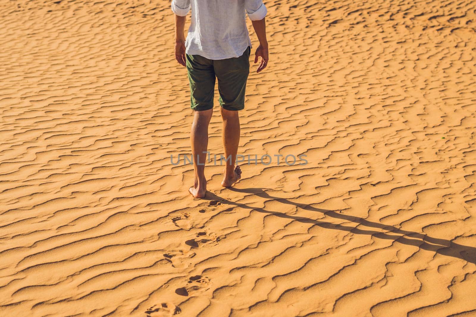 A man lost in the red desert in Vietnam, Mui Ne.