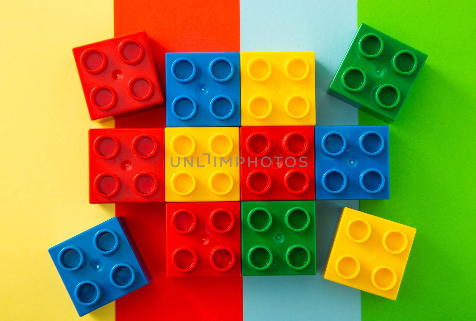 Colorful plastic block on colorful background. by tehcheesiong