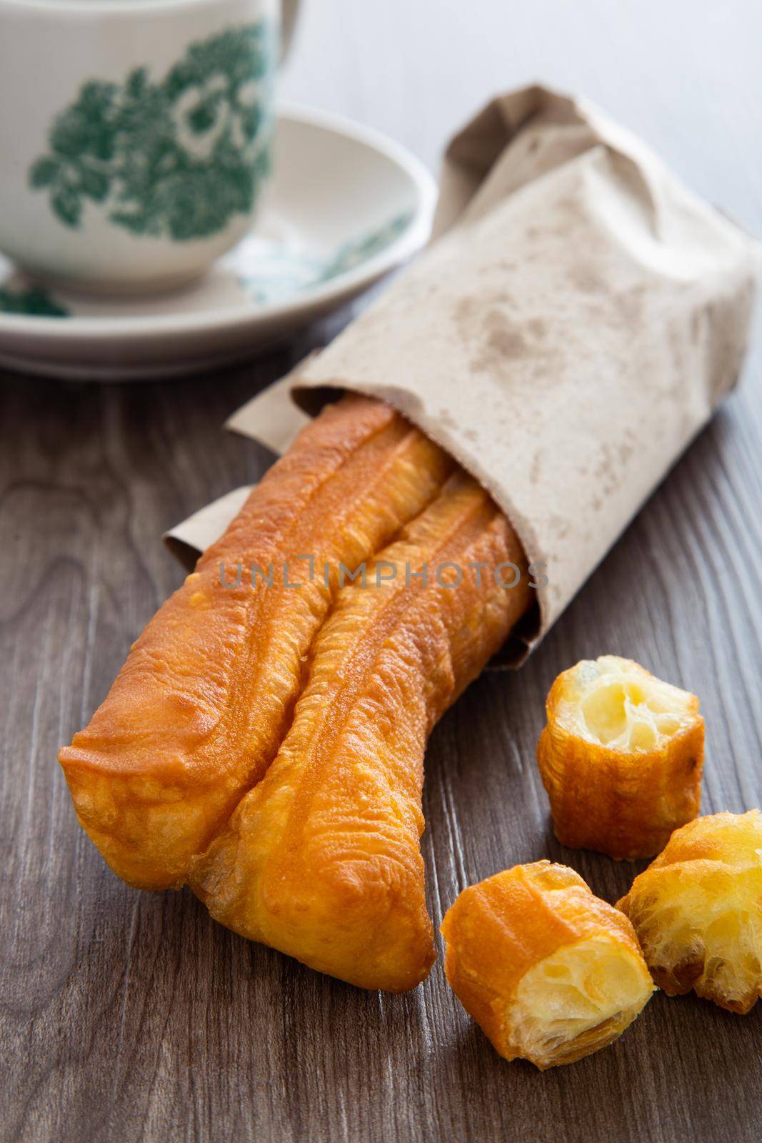 Youtiao (Chinese fried breadstick). Long golden brown deep fried dough strip.