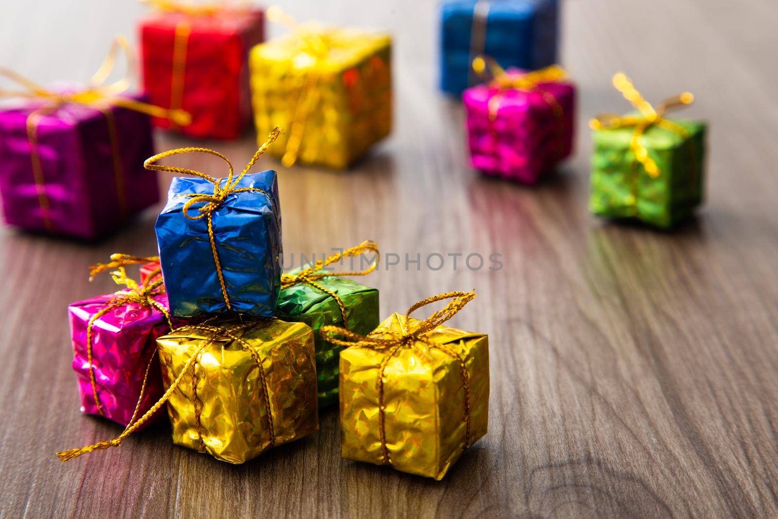 Christmas composition. Christmas gifts, decorations on wooden background. Copy space