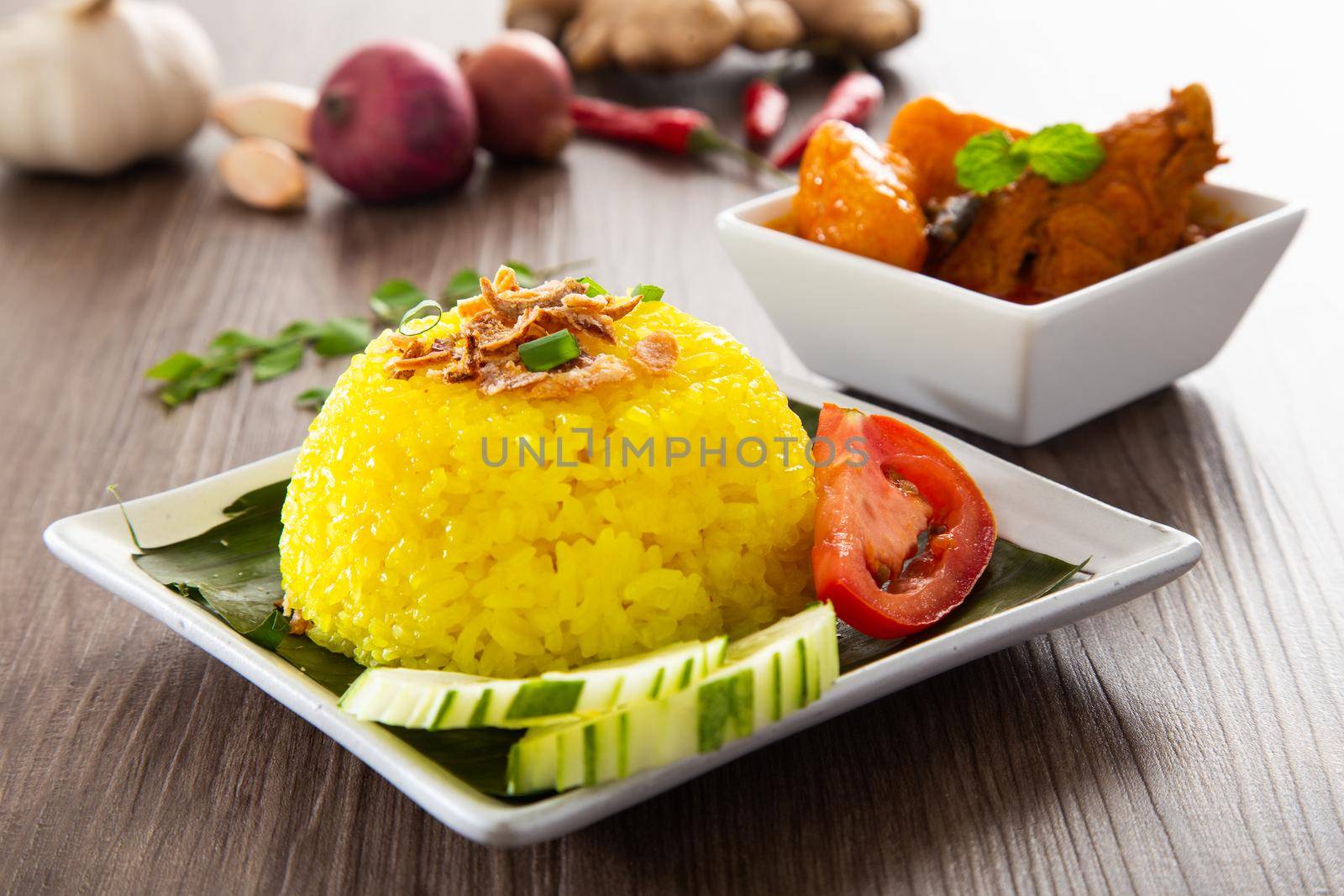 Nasi Kunyit also known as Turmeric Glutinous Rice. Normally eaten with dry curry chicken. by tehcheesiong