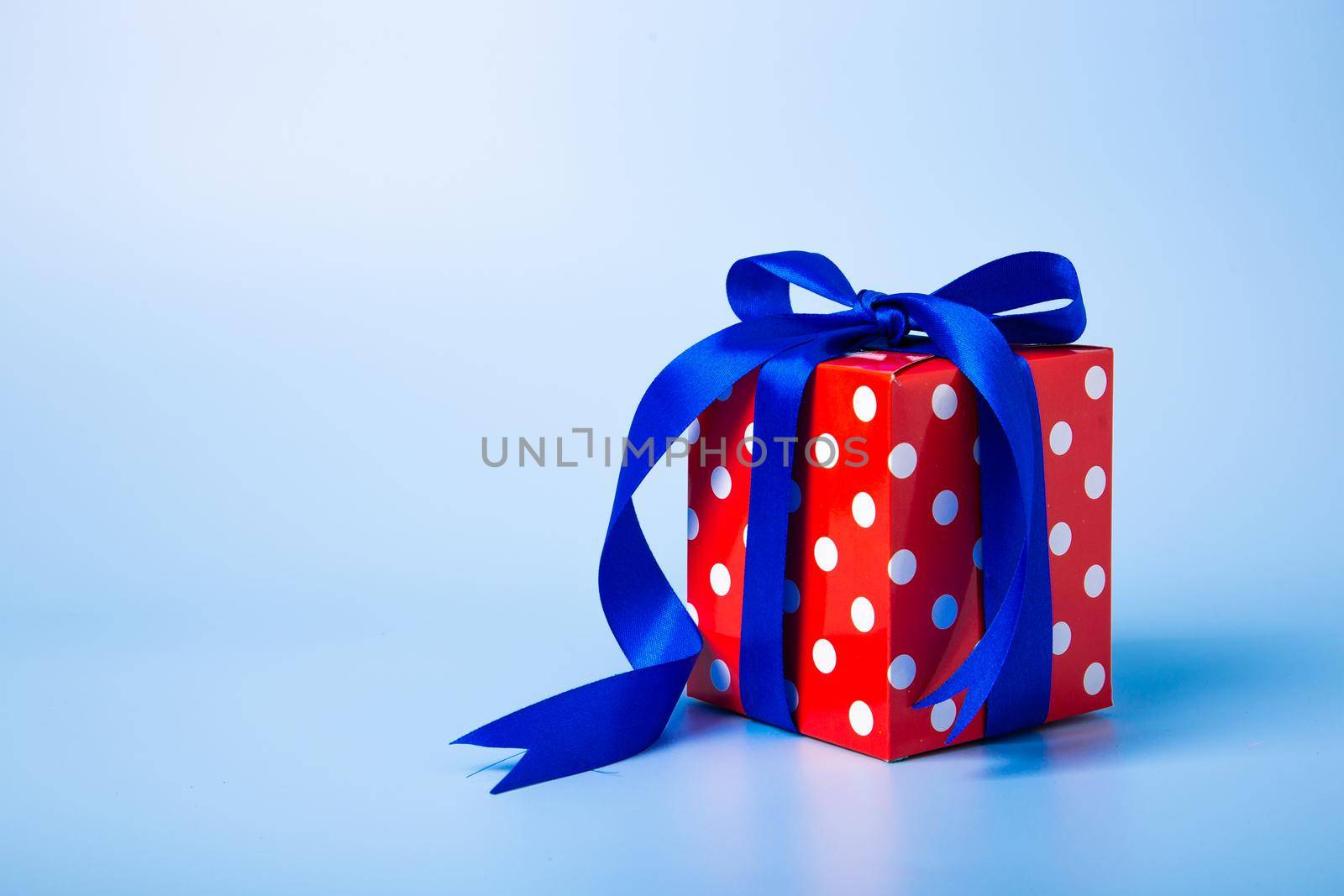 Christmas composition. Christmas gifts, decorations on blue background.