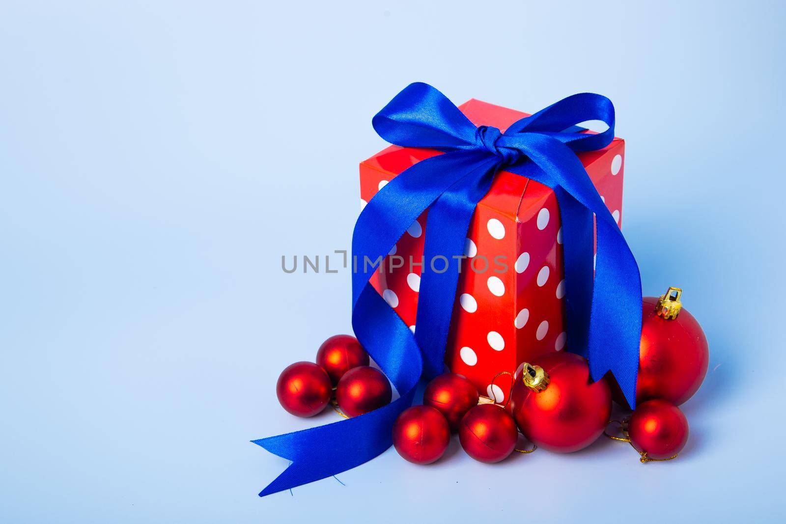 Christmas composition. Christmas gifts, decorations on blue background.