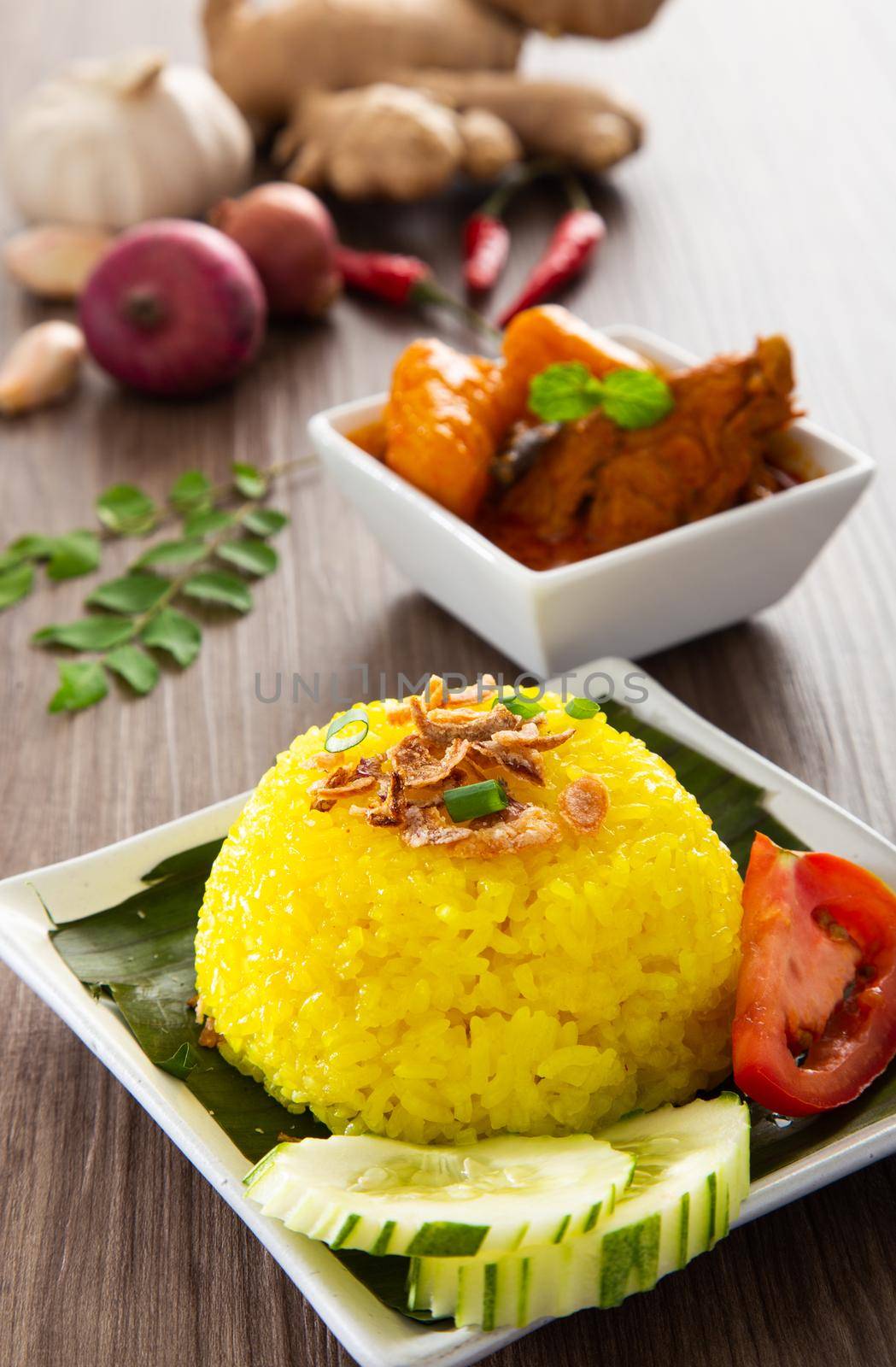 Turmeric Glutinous Rice also known as Nasi Kunyit. Normally eaten with dry curry chicken.