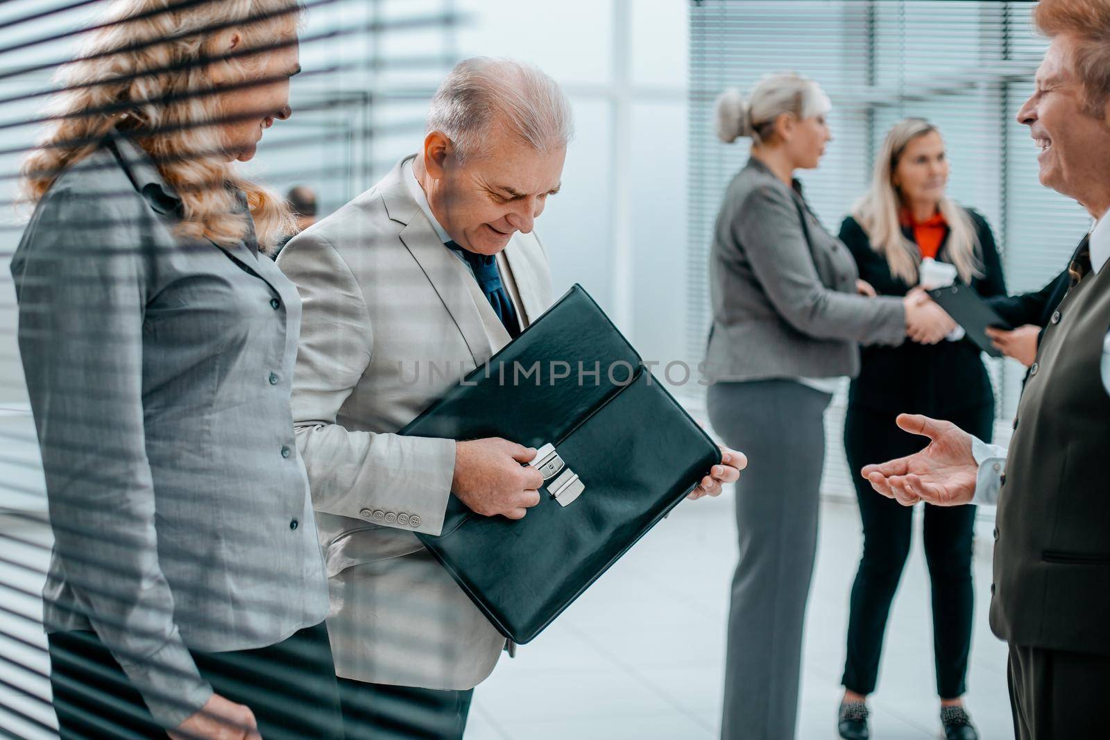 close up. a group of business people are preparing for the beginning of the working meeting.