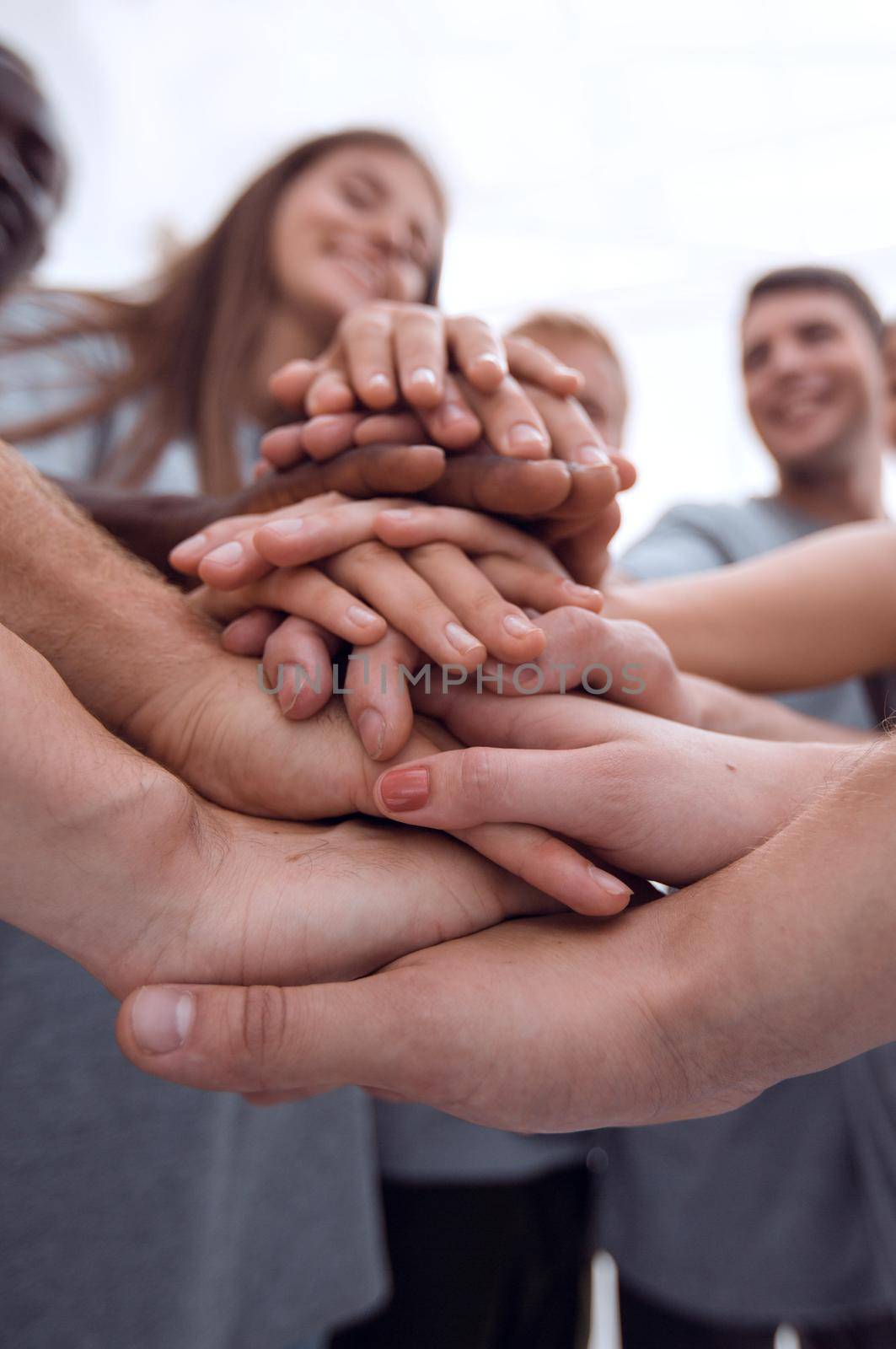 close up. a group of young people showing their unity by asdf