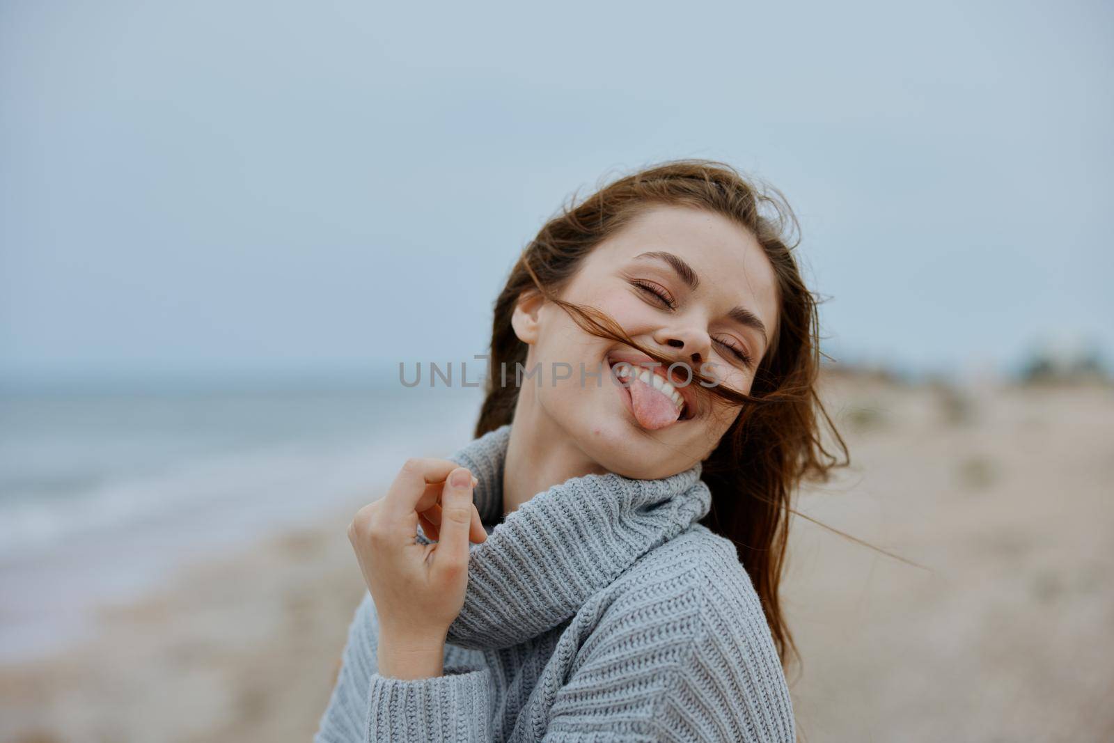 cheerful woman with long hair on the beach nature landscape walk Lifestyle by SHOTPRIME
