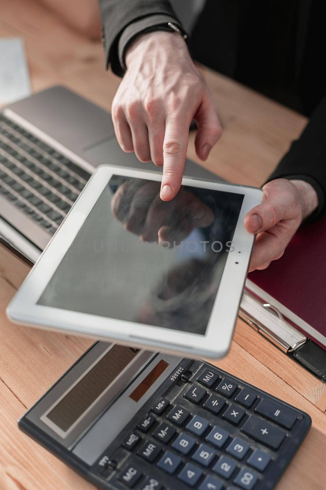 man holding digital tablet, closeup