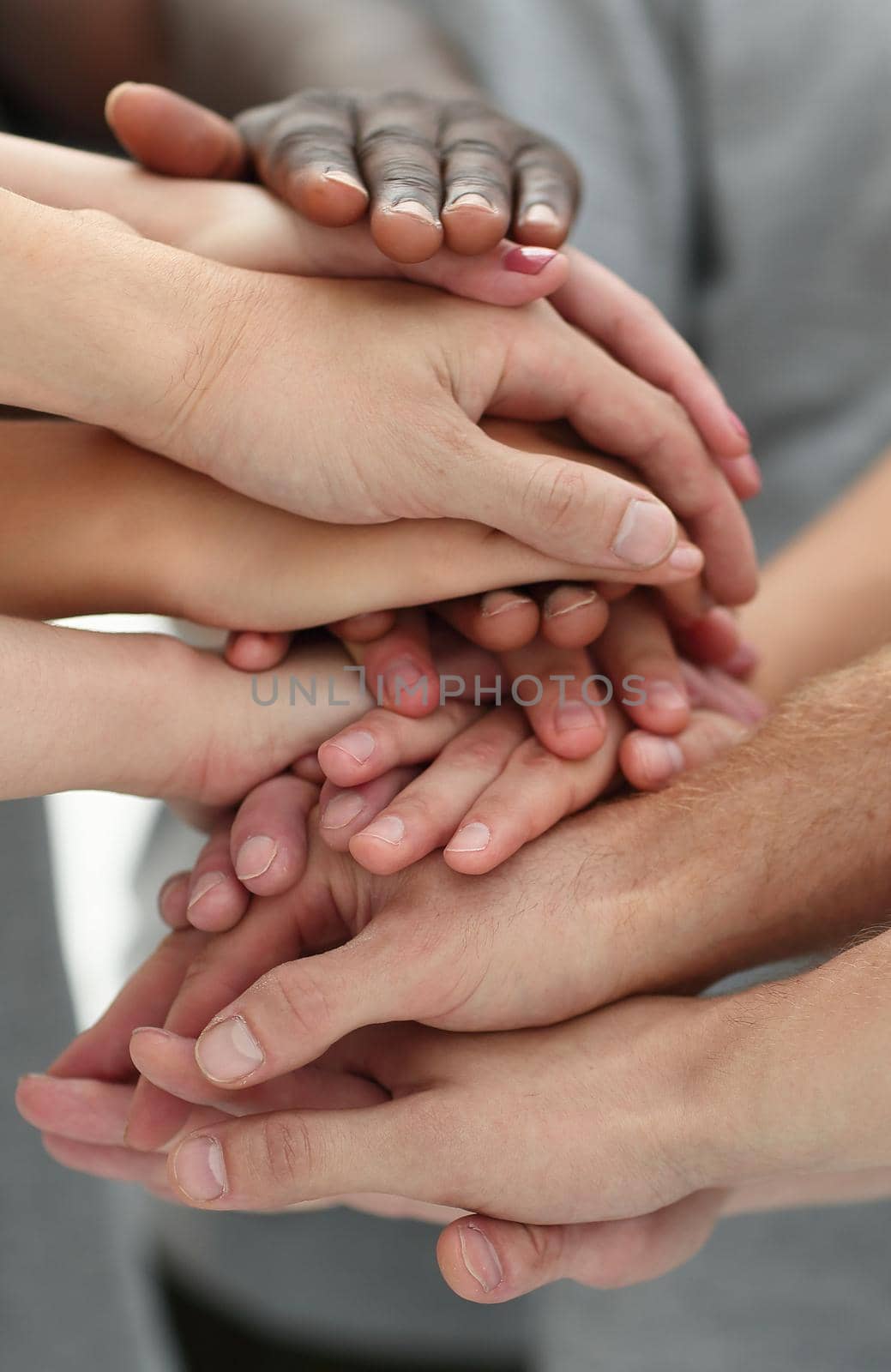 close up. young people making a tower of hands. by asdf