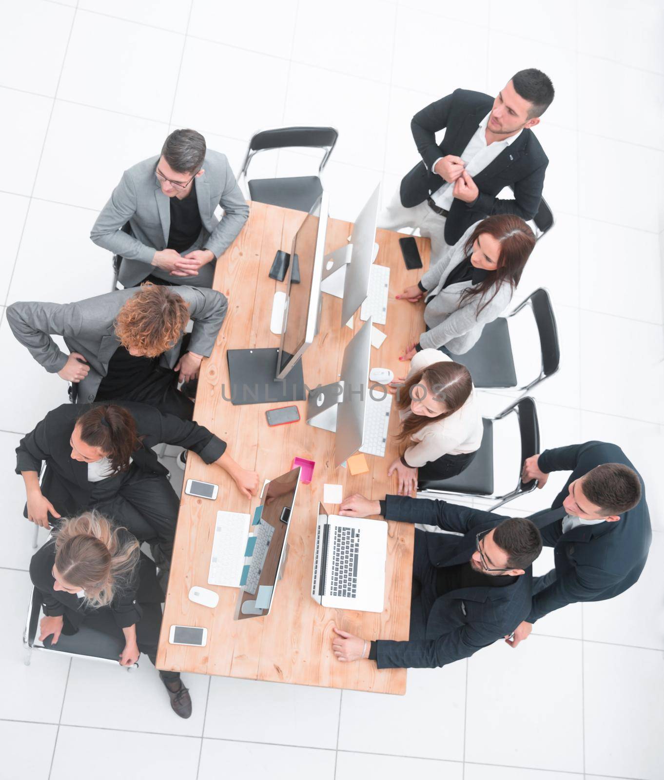 top view. business team sitting at the Desk. the concept of teamwork