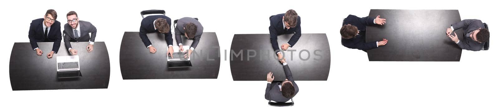 top view. two business people sitting at the Desk. isolated on white background