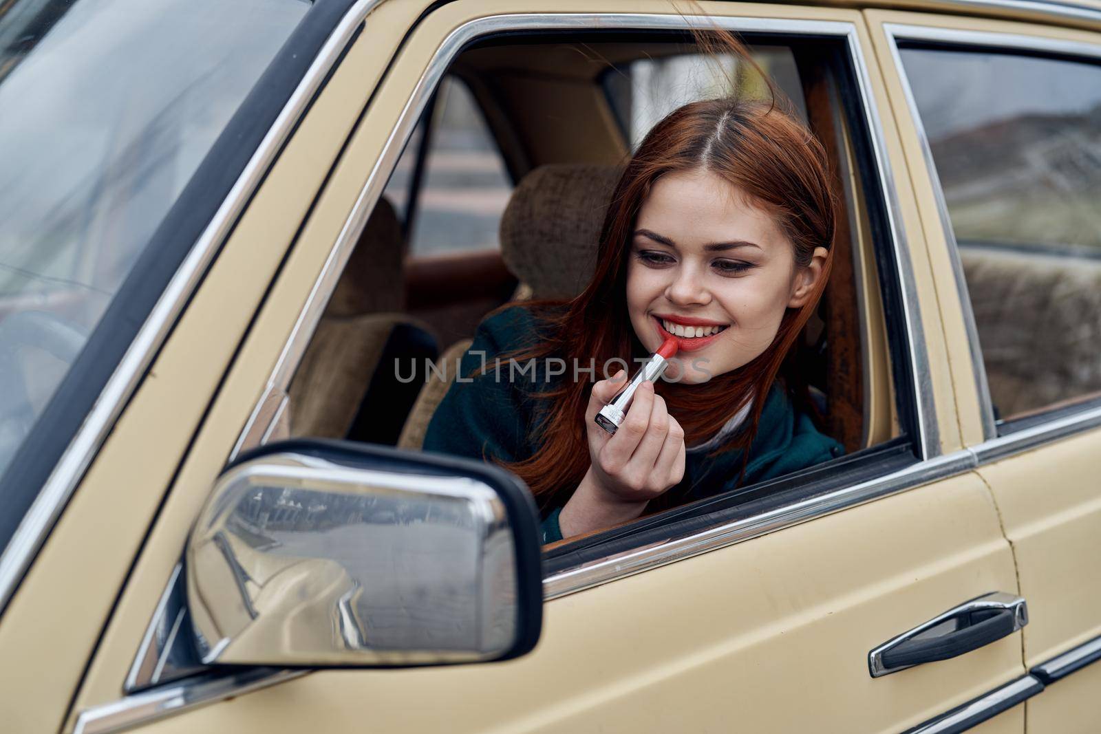 woman peeking out of car trip lifestyle fashion. High quality photo