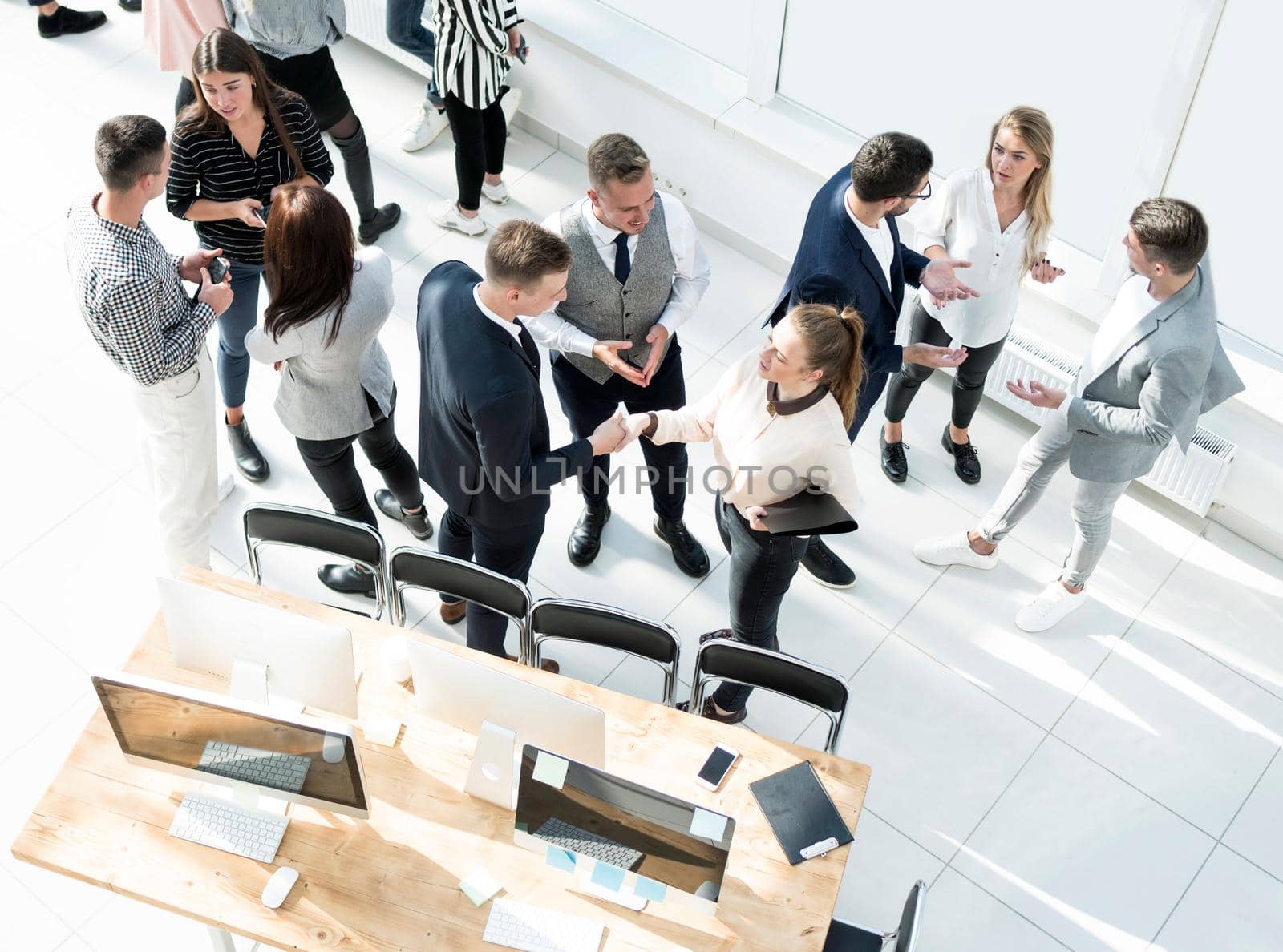 top view. a group of employees discussing work issues by asdf