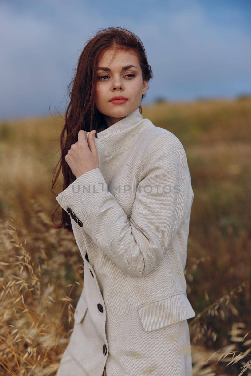 woman walk in the field autumn season concept. High quality photo