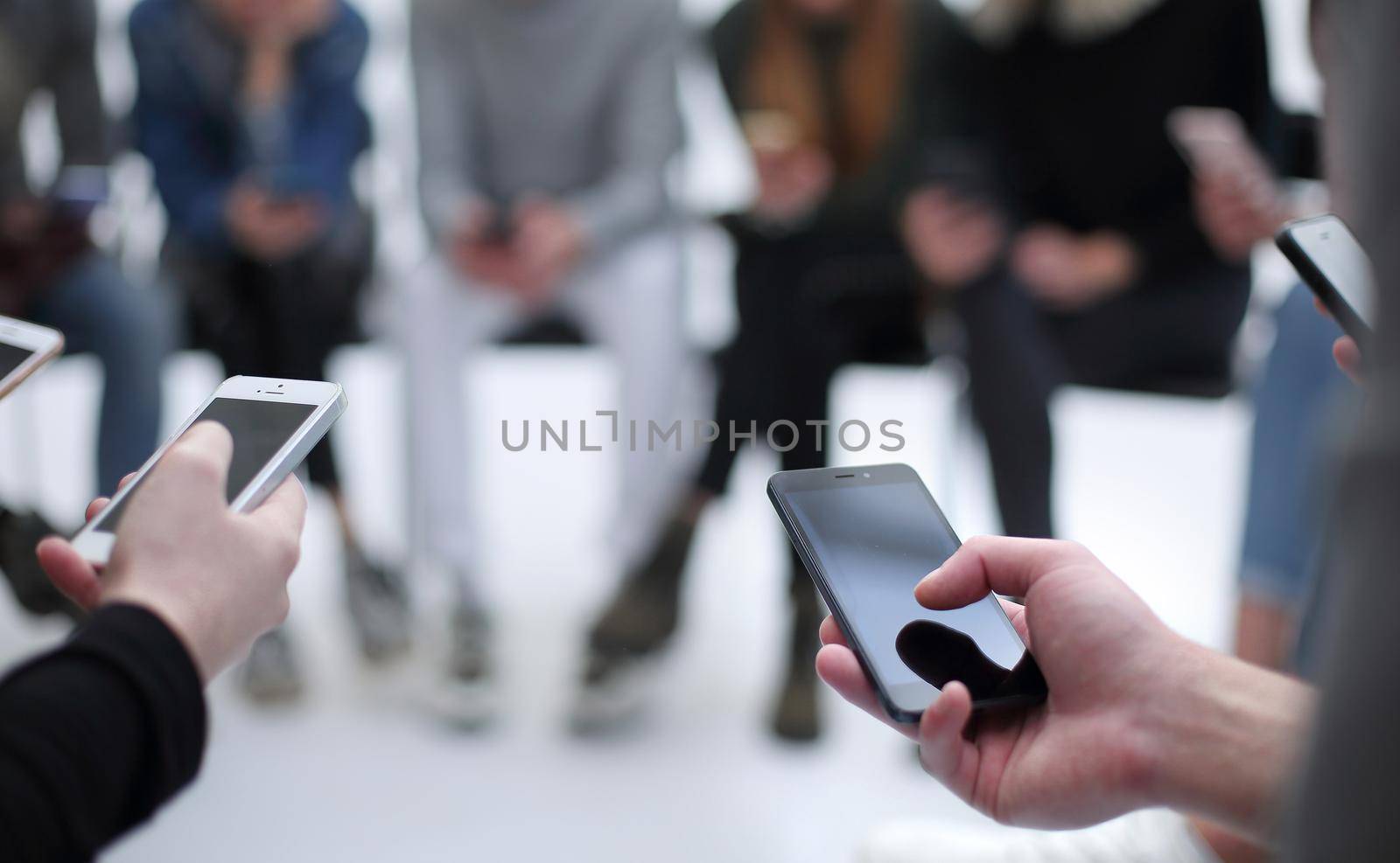 close up. groups of young people with smartphones. people and technology