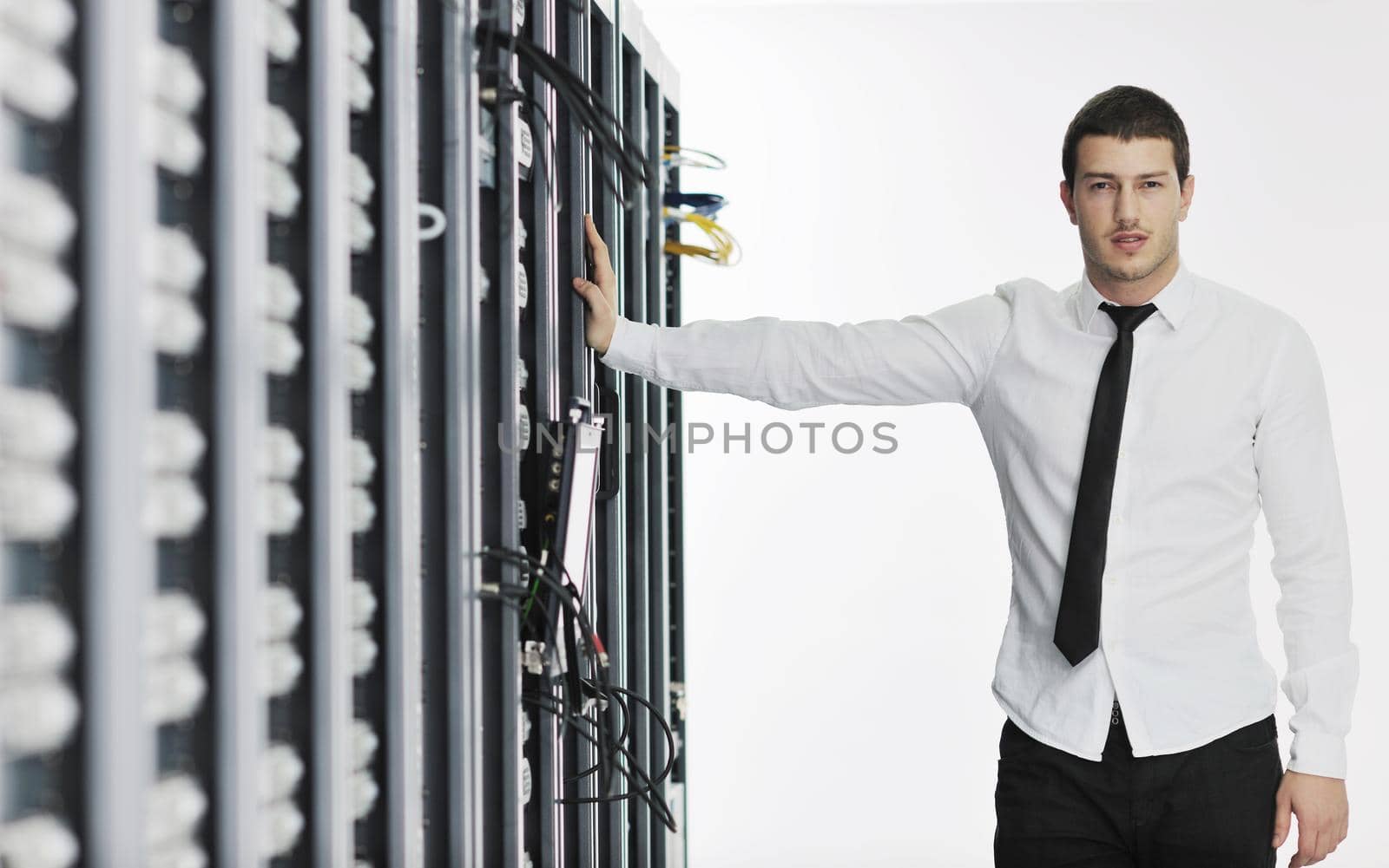 young it engeneer in datacenter server room by dotshock