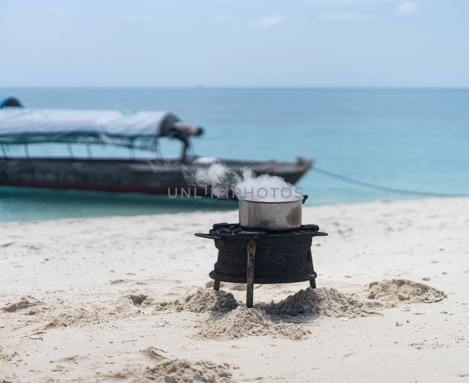 Having joy on beach sand making the food