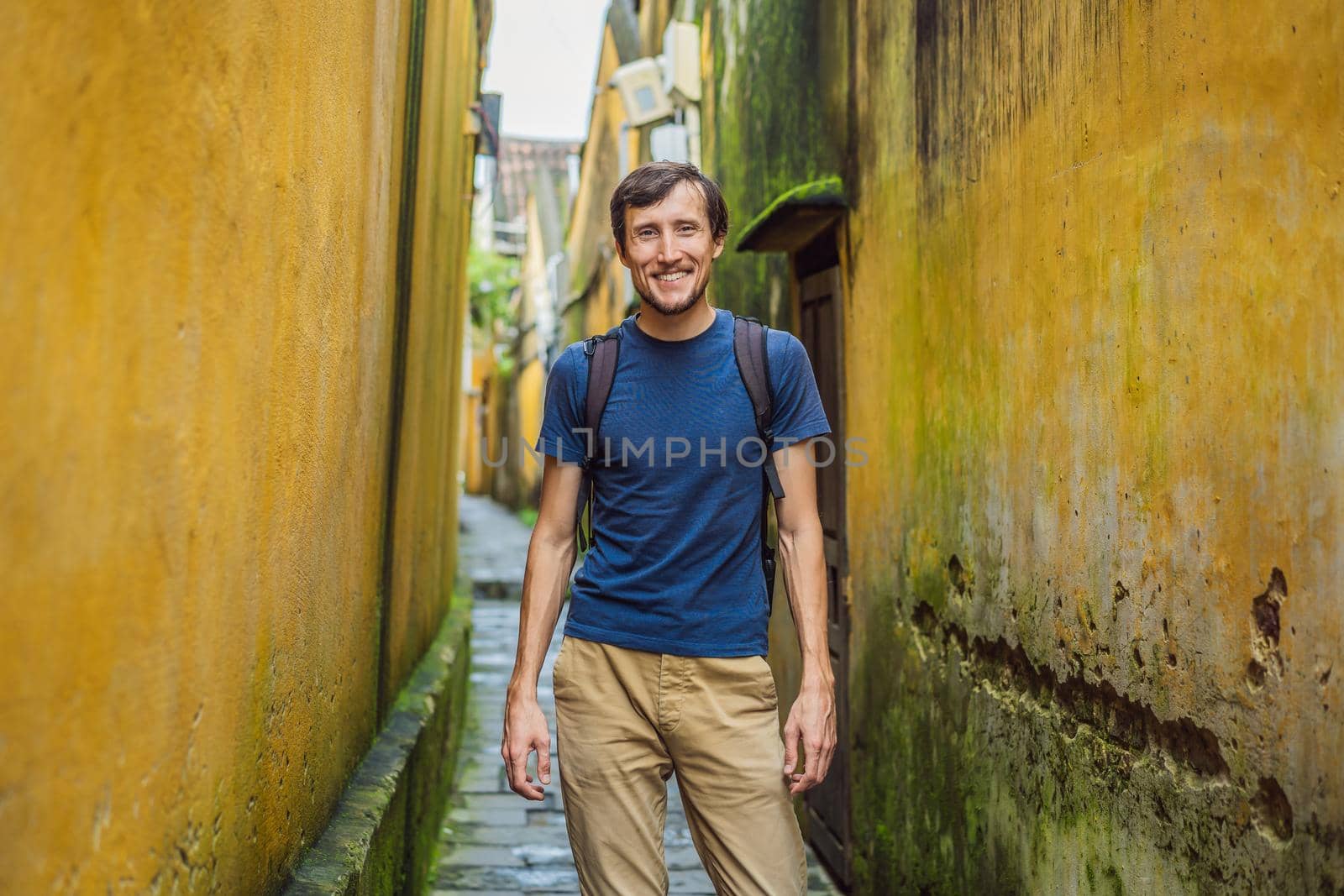 Man tourist on background of Hoi An ancient town, Vietnam. Vietnam opens to tourists again after quarantine Coronovirus COVID 19 by galitskaya