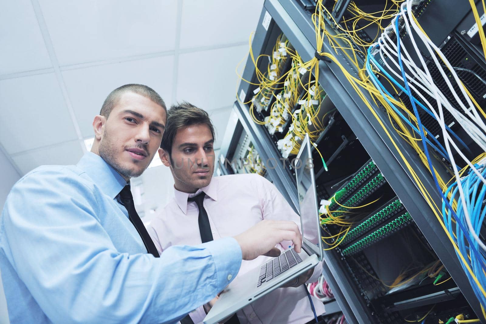 it engineers in network server room by dotshock