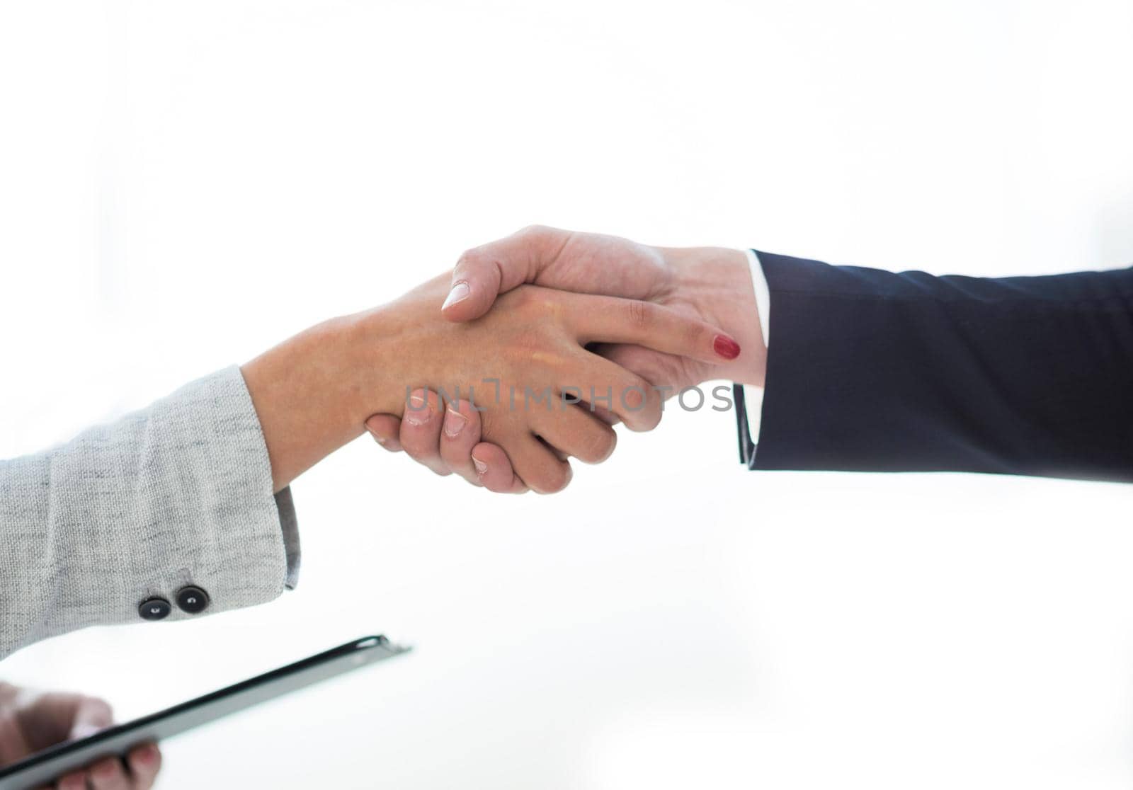 close up. businessman and businesswoman shaking hands with each other. concept of cooperation