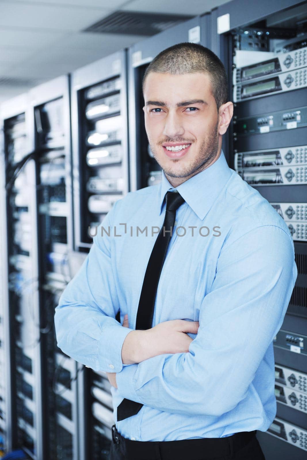 young handsome business man  engineer in datacenter server room