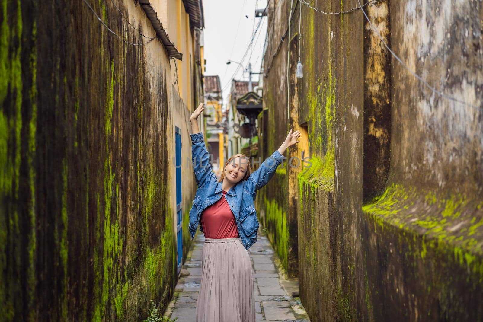 Woman tourist on background of Hoi An ancient town, Vietnam. Vietnam opens to tourists again after quarantine Coronovirus COVID 19 by galitskaya