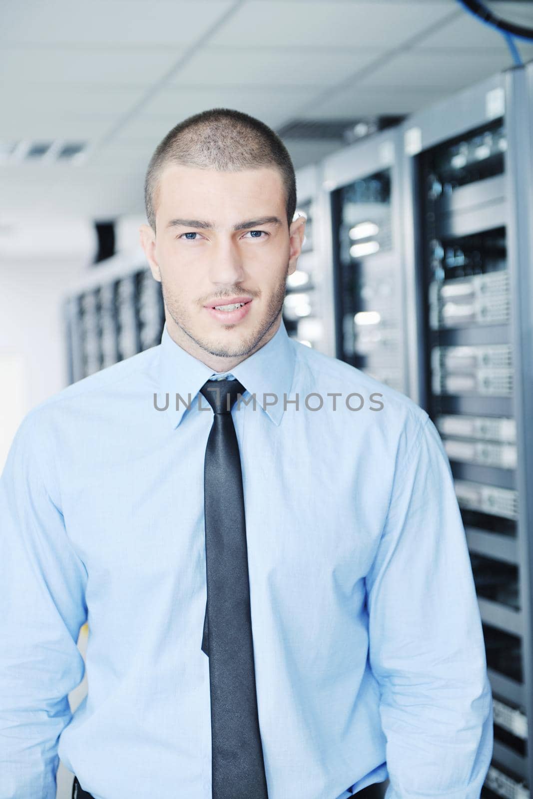 young handsome business man  engeneer in datacenter server room